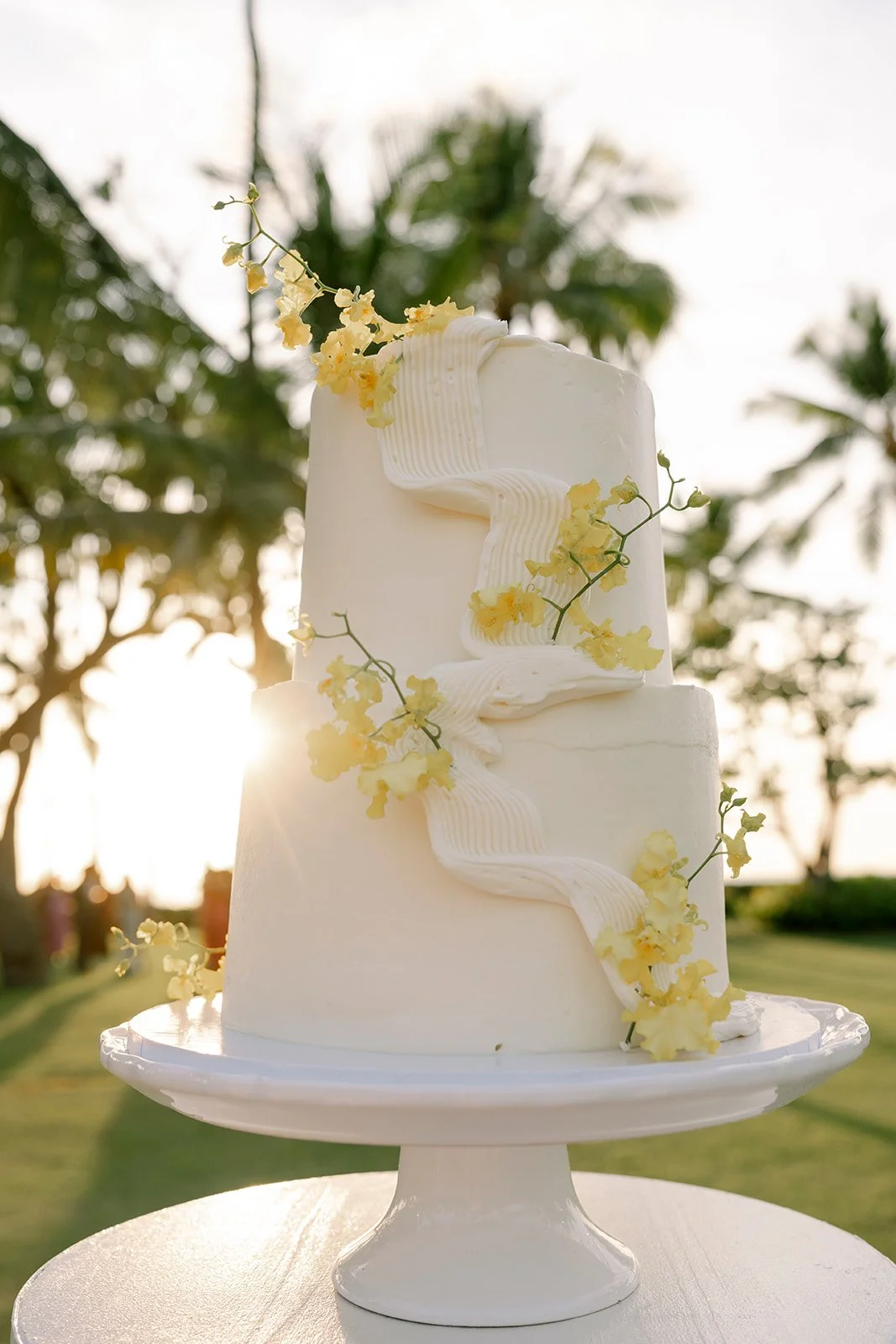 wedding cake with yellow flowers