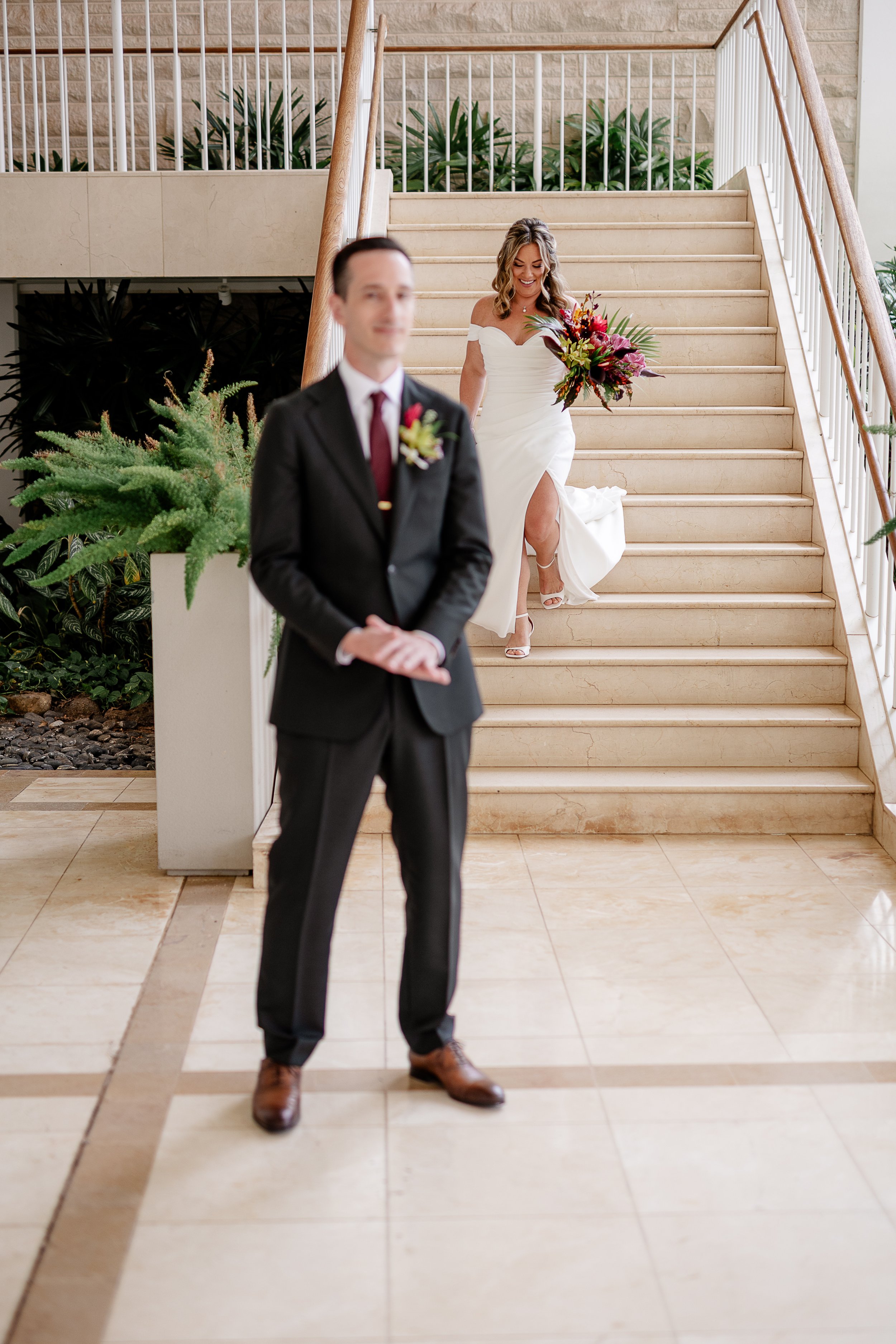 bride and groom first looks with tropical bouquet in Hawai'i