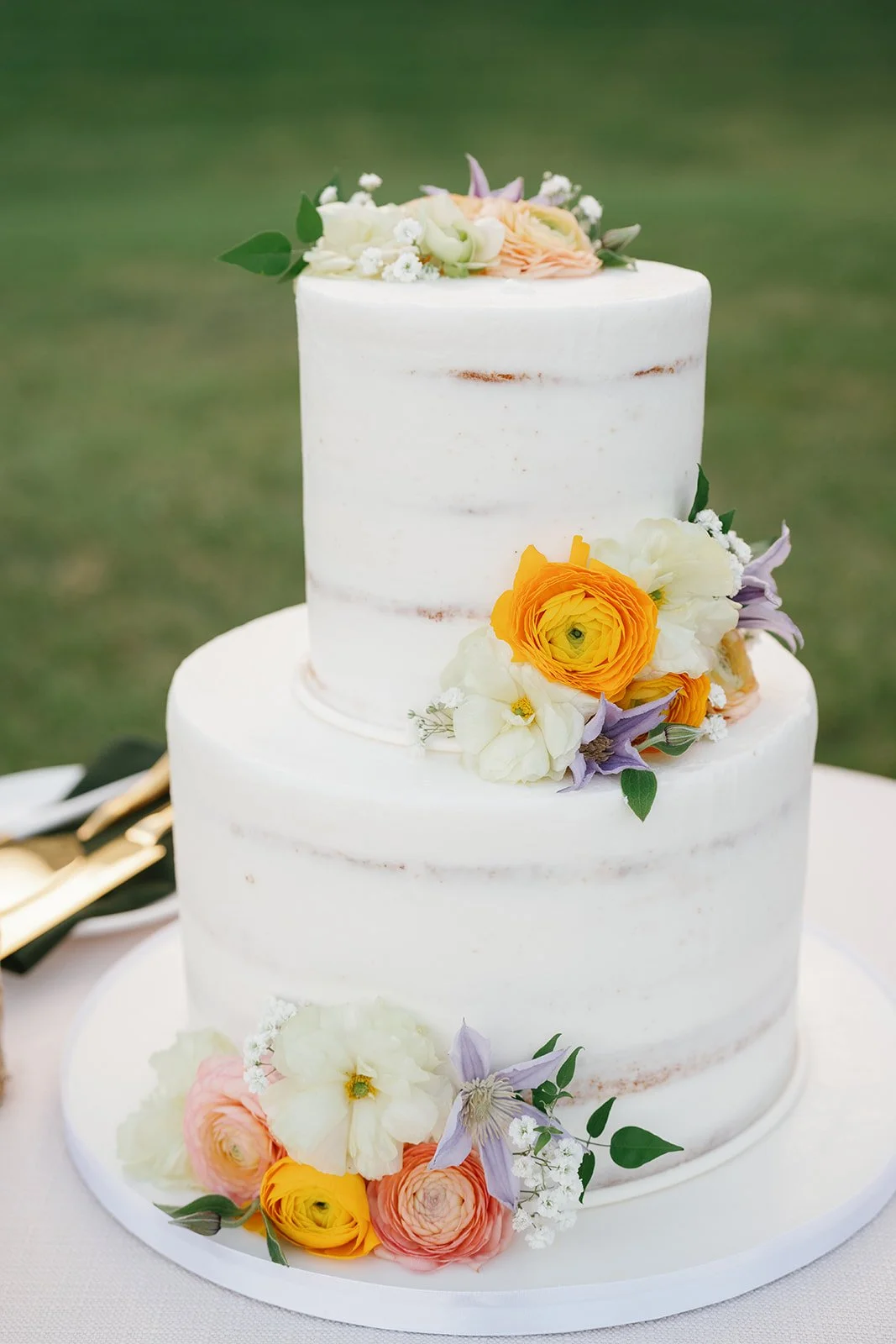 two tier cake with styled flowers