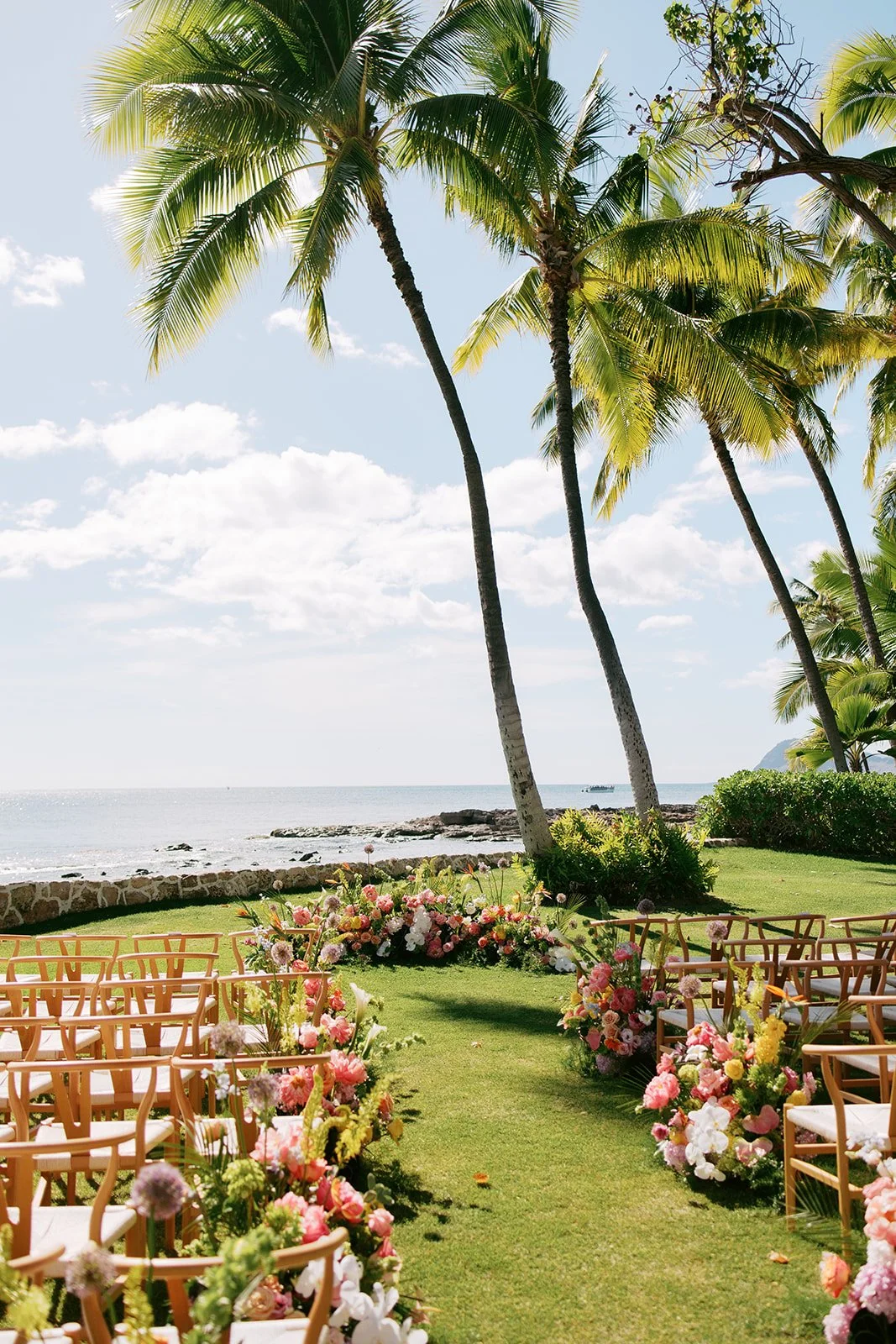 wedding ceremony with pink orange yellow and white flowers