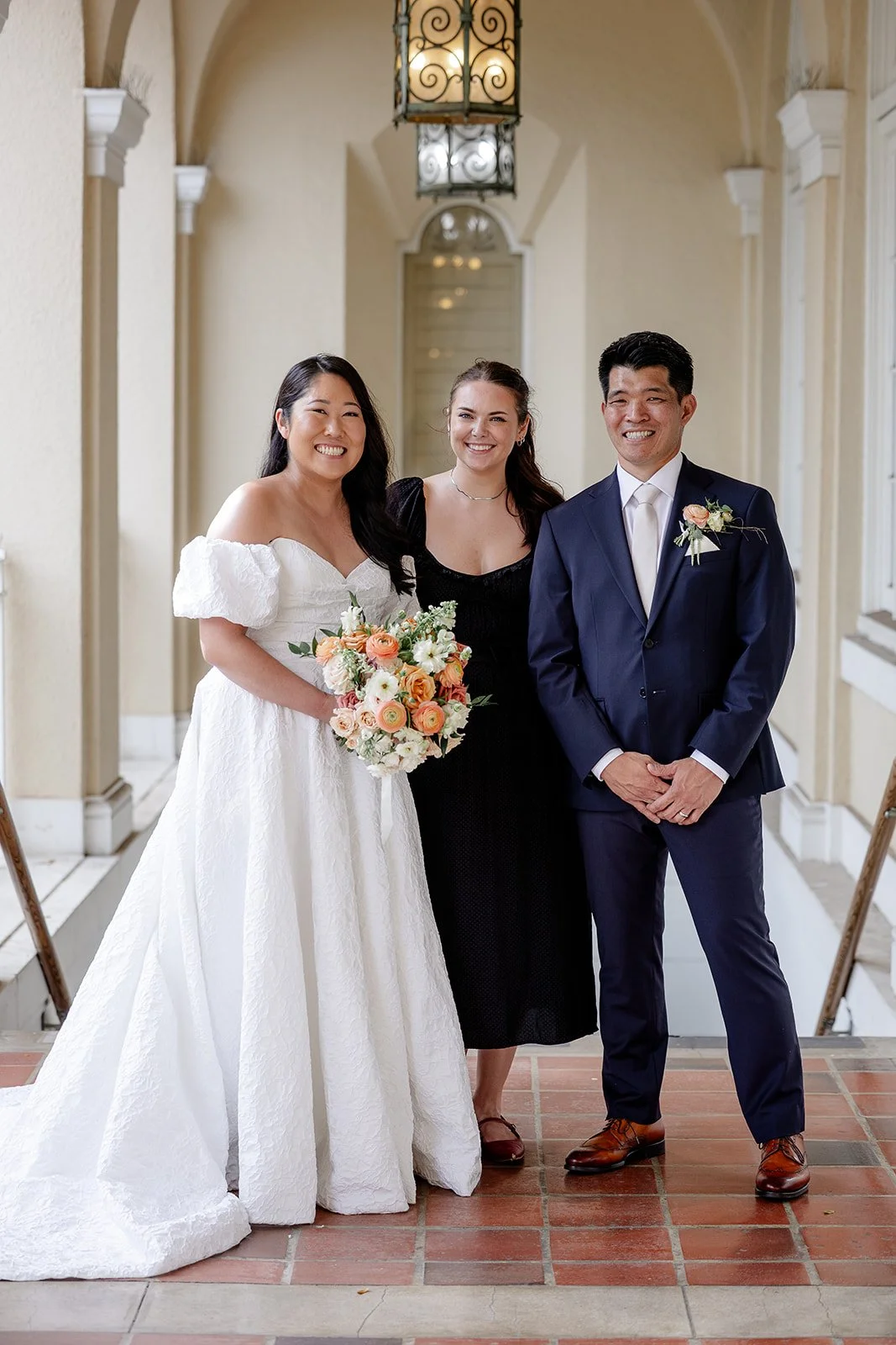 bride and groom with wedding planner from love letter weddings
