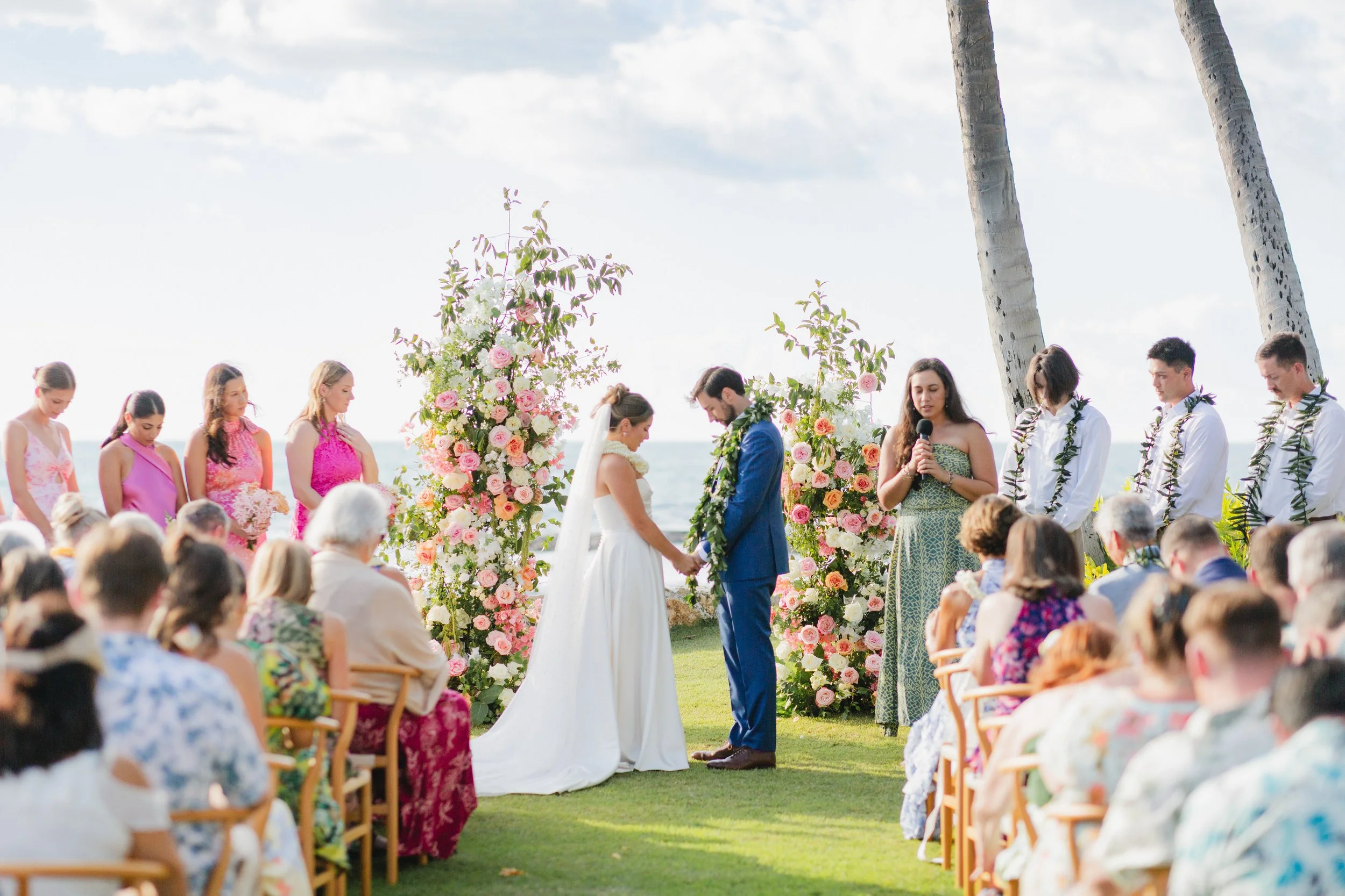 bride and groom praying together at altar