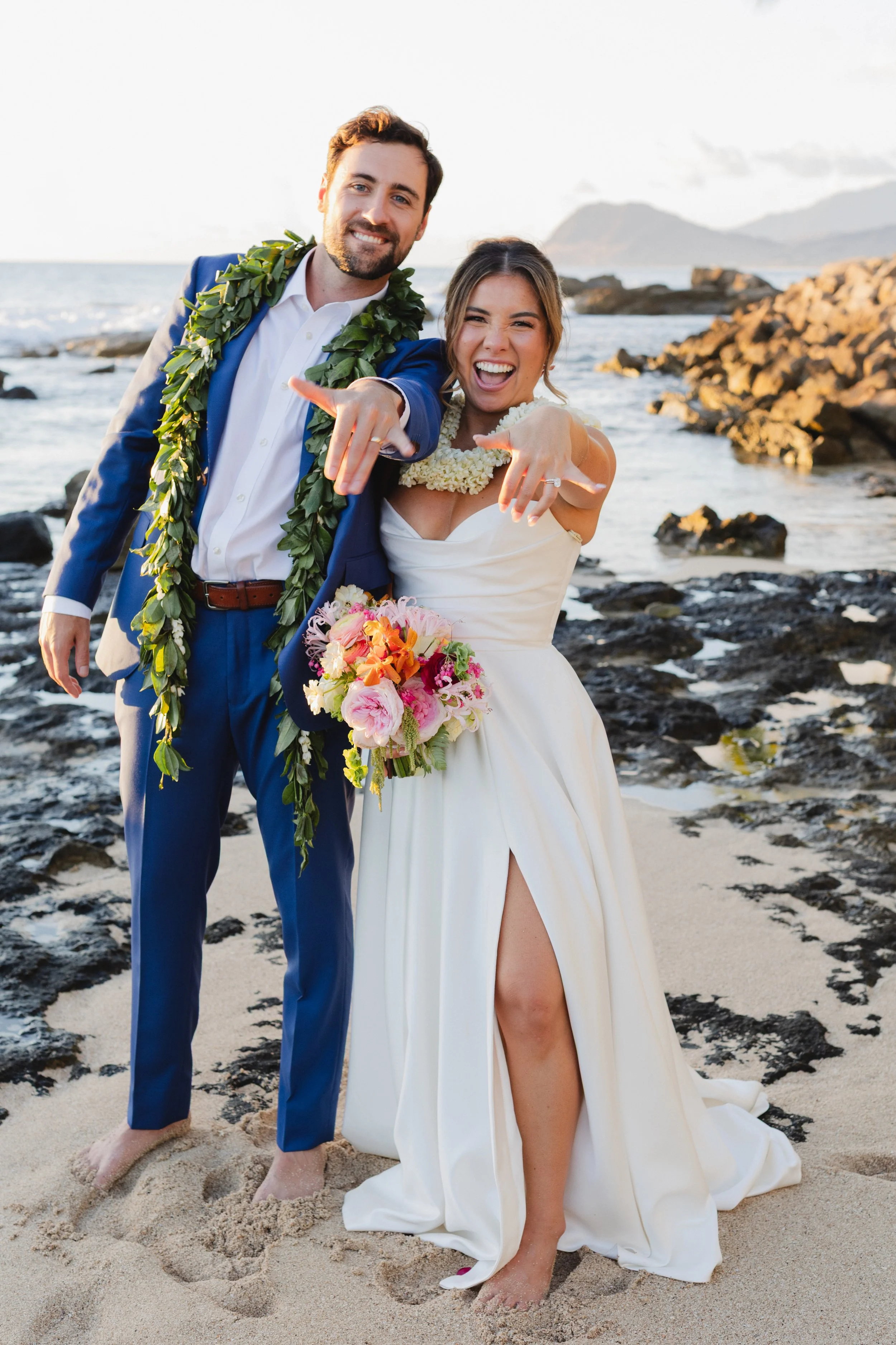 bride and groom shaka on beach in hawaii