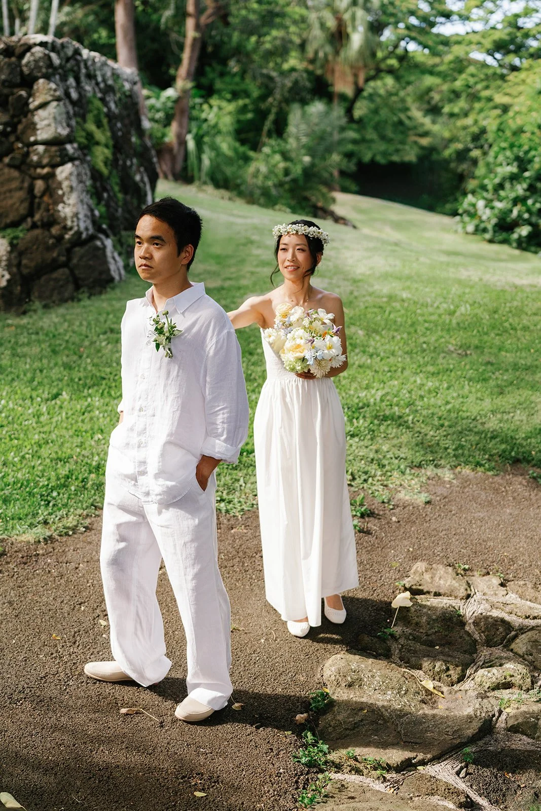 Bride behind the groom for their first wedding day look