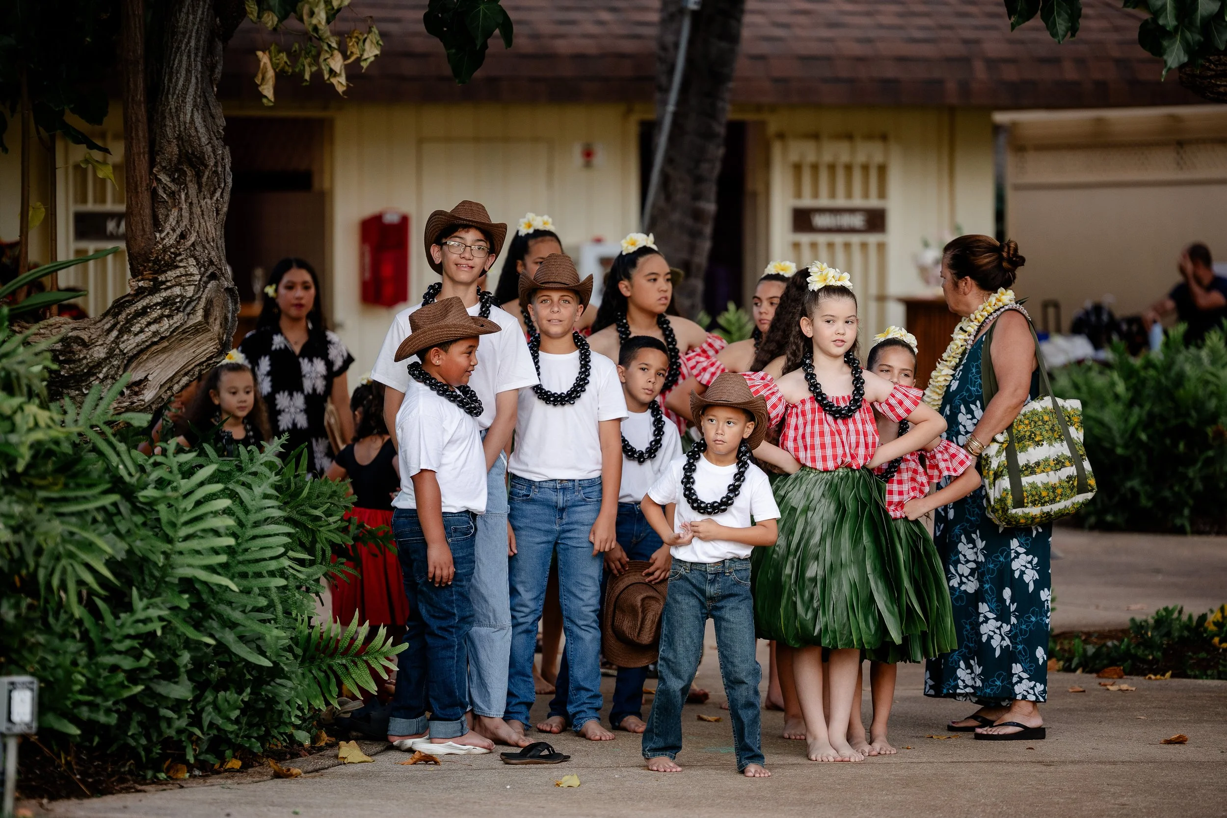 Keiki hula dancers lined up and waiting to perform for guests