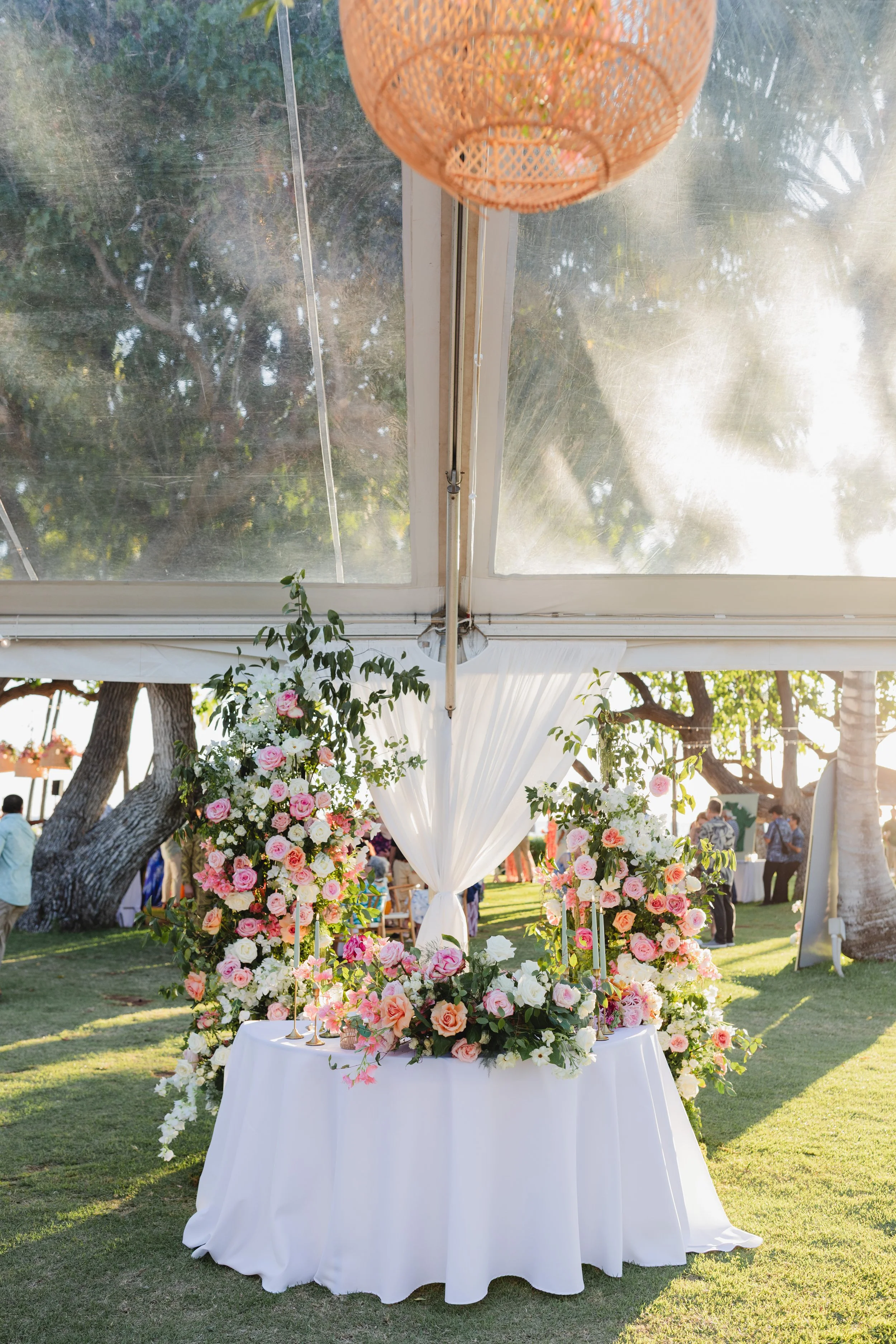 sweetheart table with pink and peach flowers