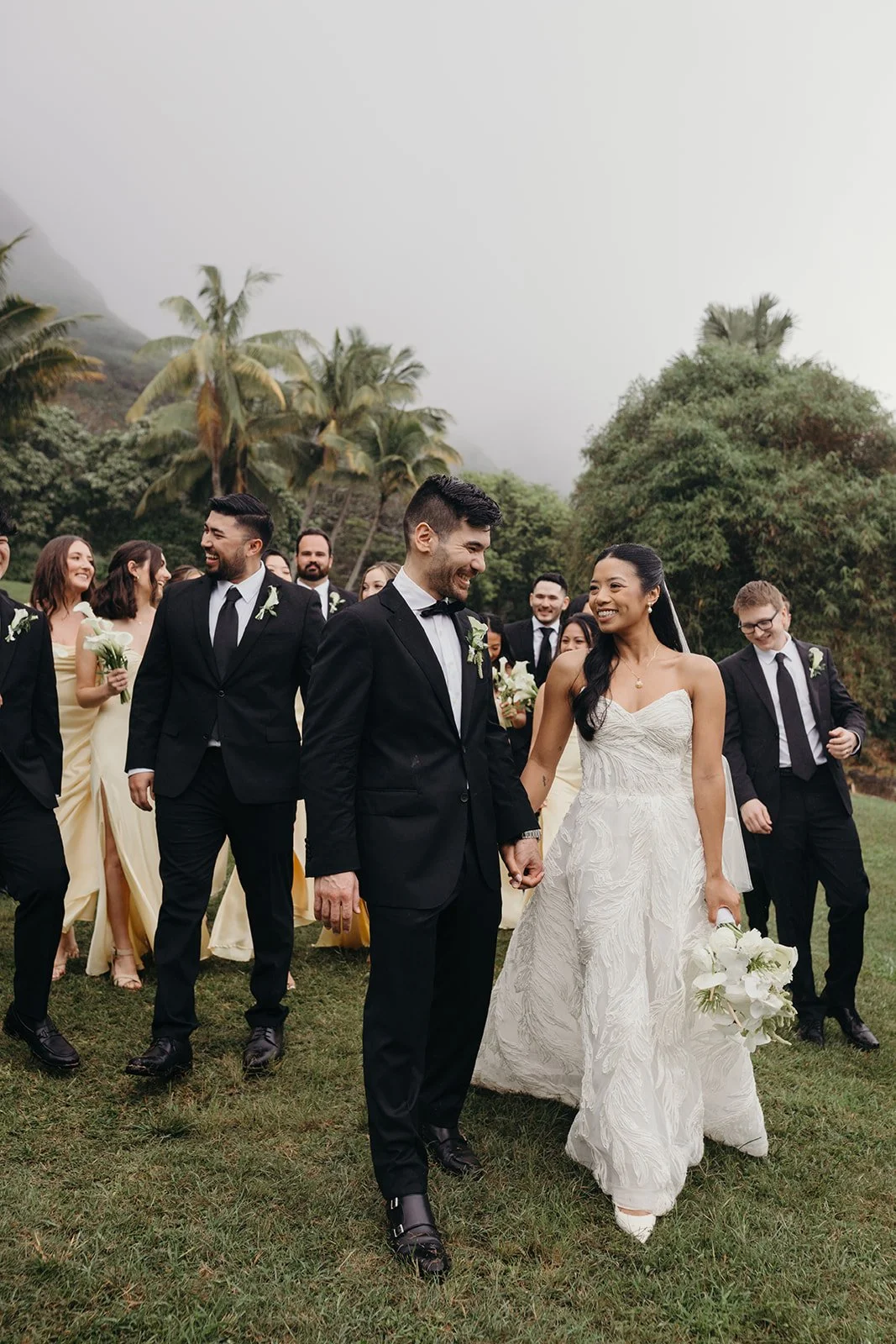 bride and groom with wedding party in hawaii