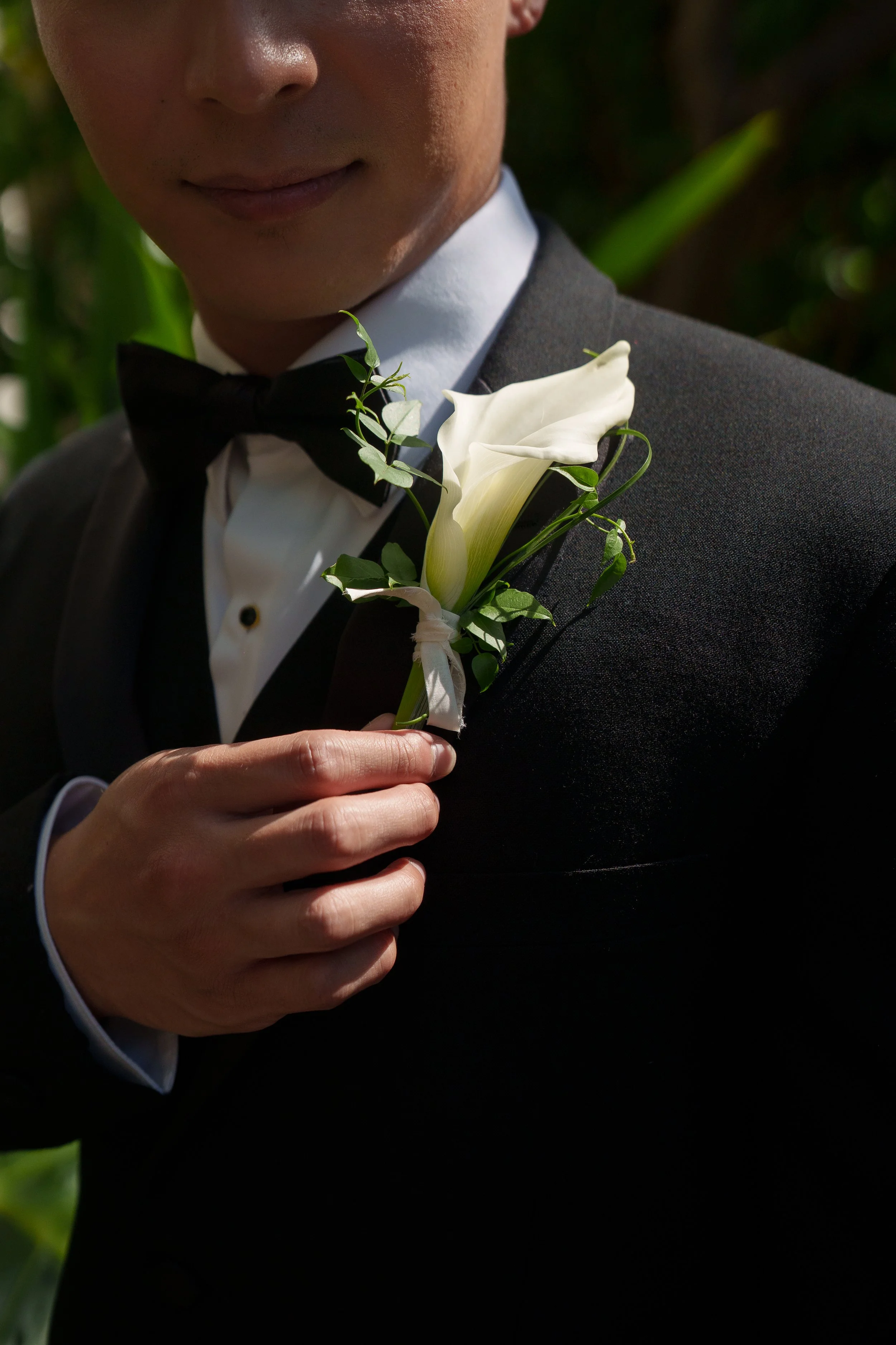 close up of grooms boutonniere