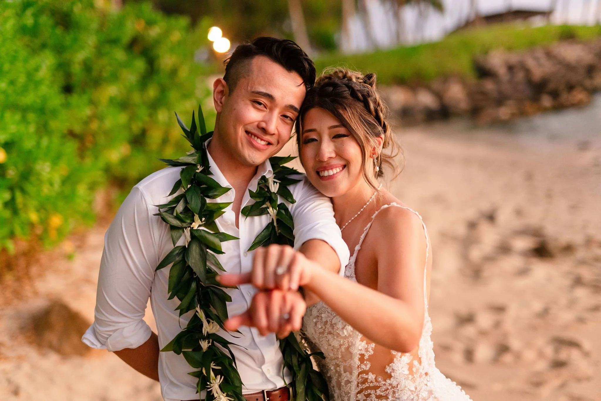 bride and groom on beach in hawaii
