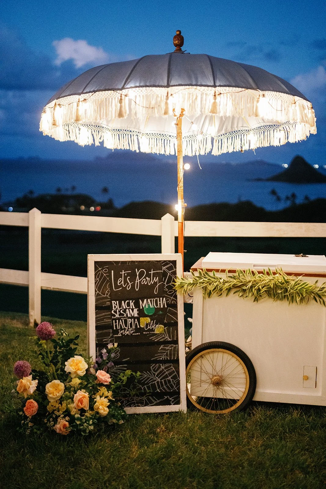 White gelato cart under umbrella