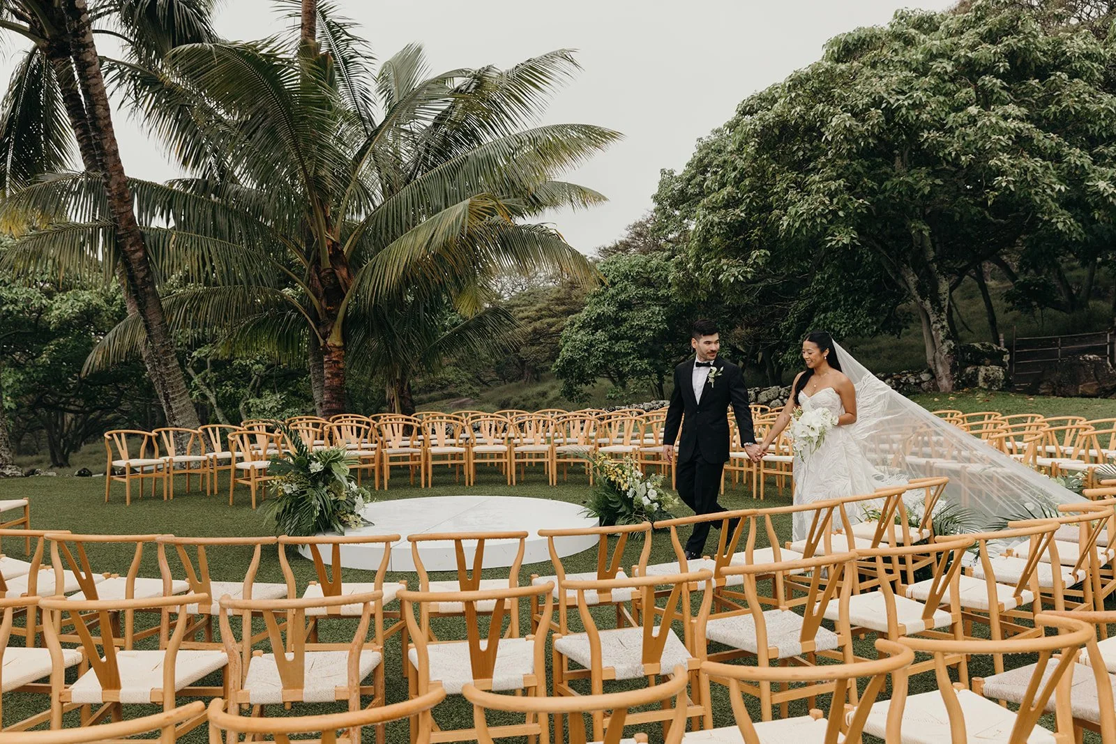 bride and groom walking through ceremony in hawaii