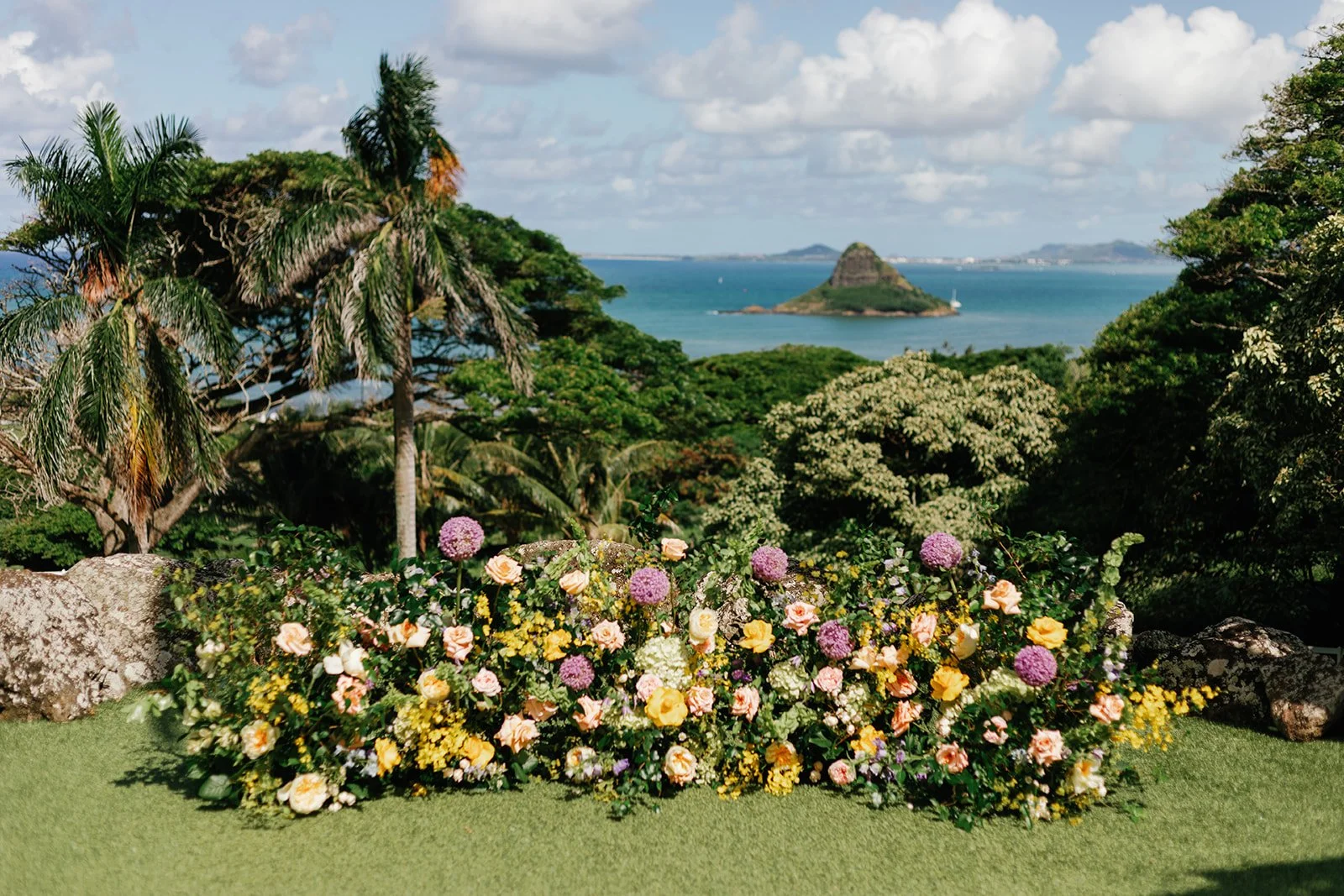 Flower alter arrangement with Chinaman's Hat in the background