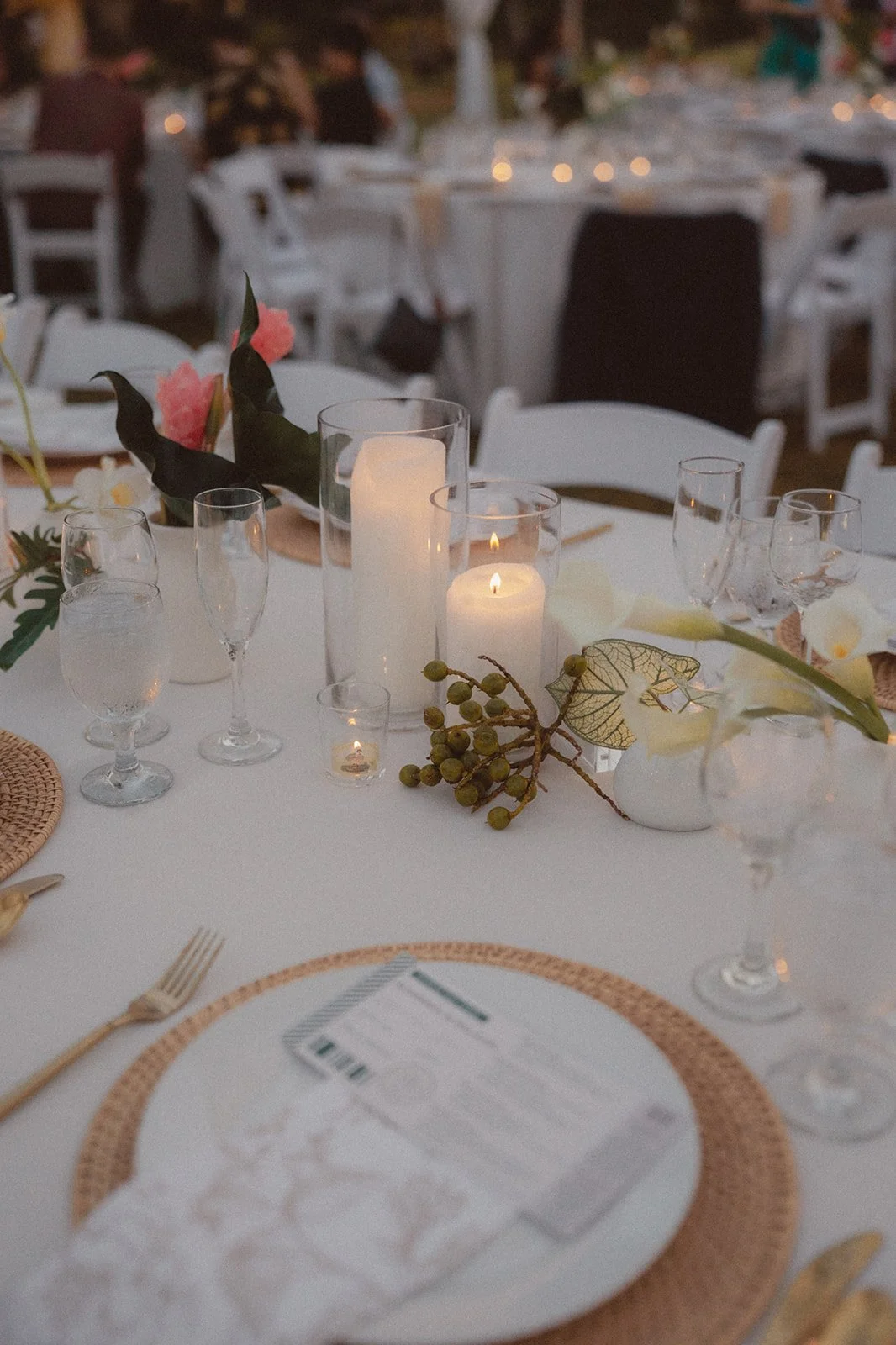 white tablescape with tropical flowers
