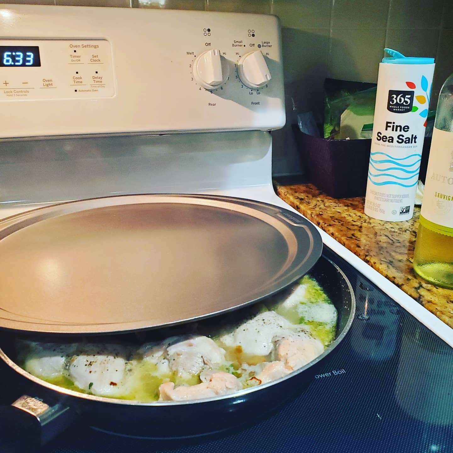 Pro tip: When without a lid to simmer chicken, use a pizza pan -- while also listening to The Police on headphones.