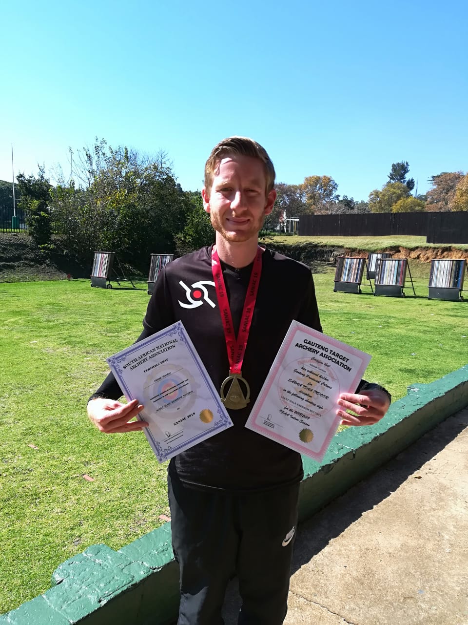 Coach_Alistair_with_Provincial_and_National_Colours.jpeg