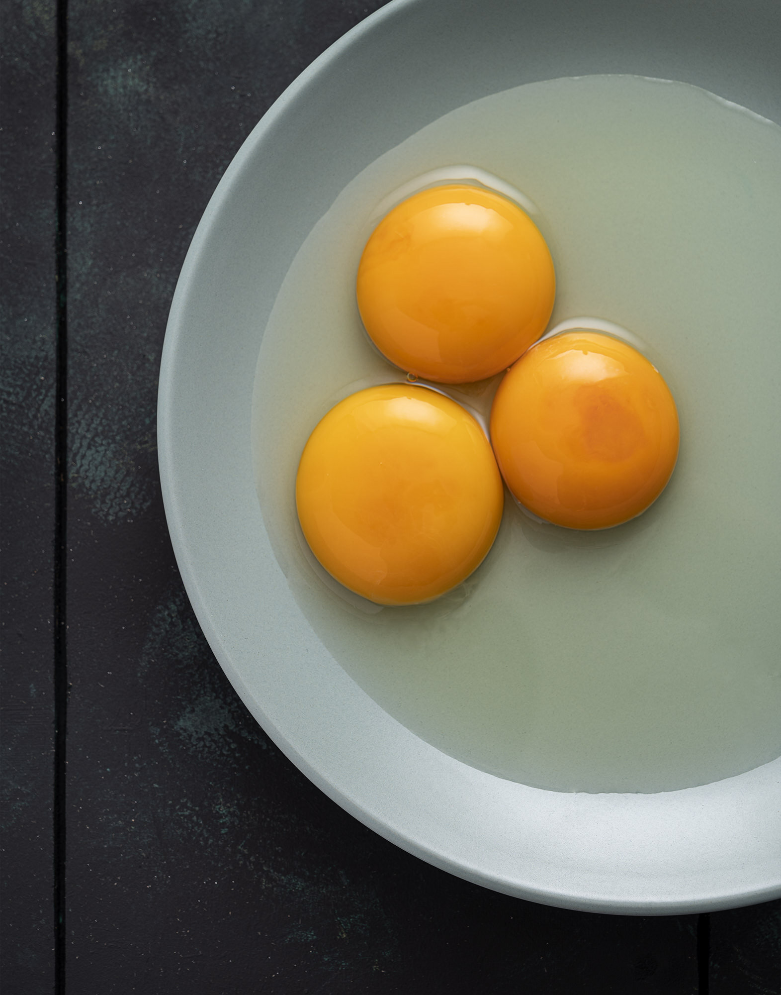 Raw eggs on a plate