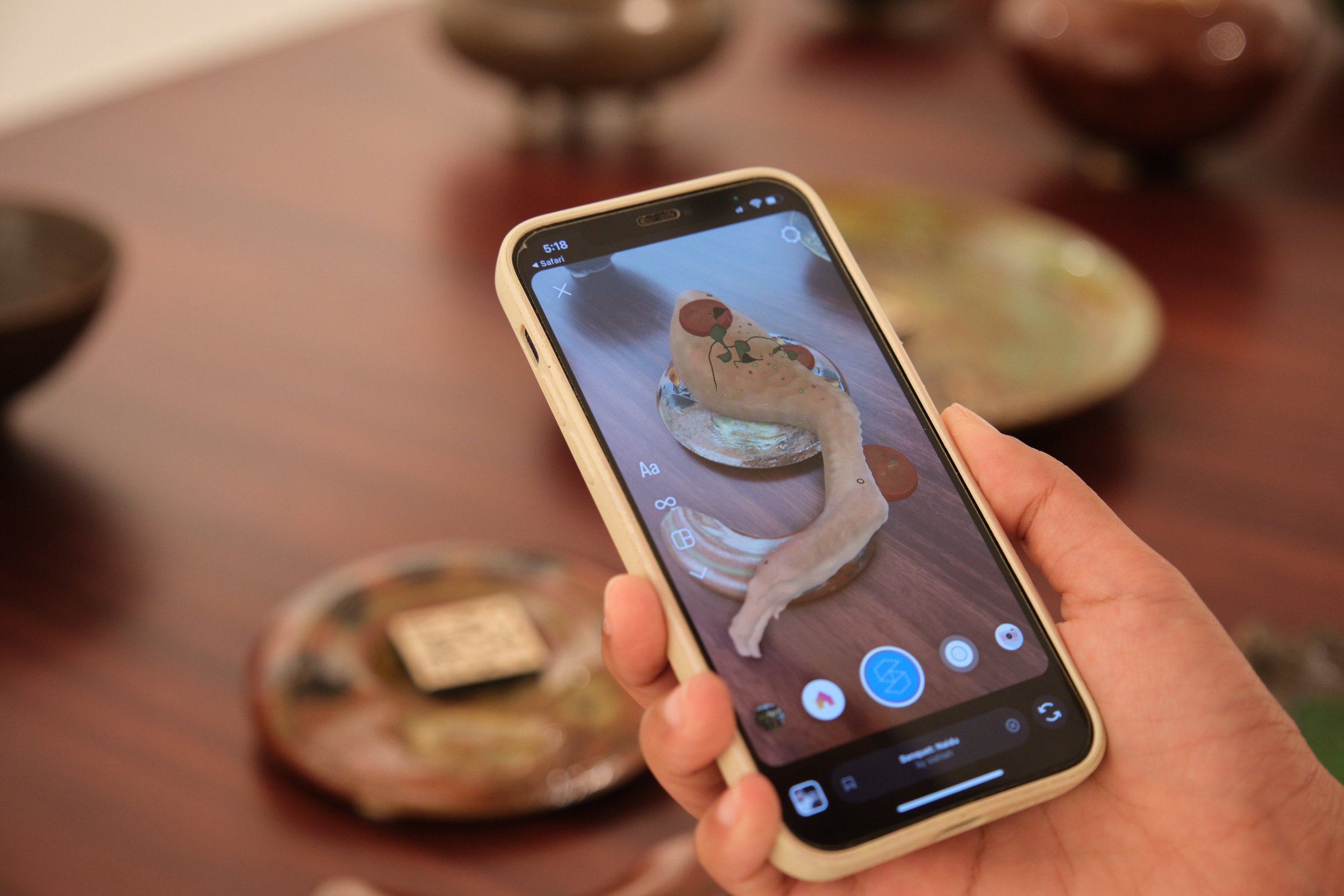  Viewing the virtual food through a mobile device Photo by  Art Outreach Singapore  