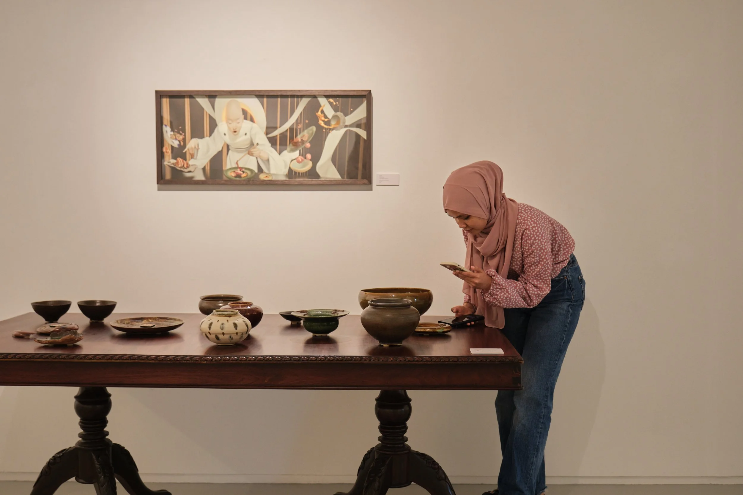  Visitor scanning the QR code Photo by  Art Outreach Singapore  