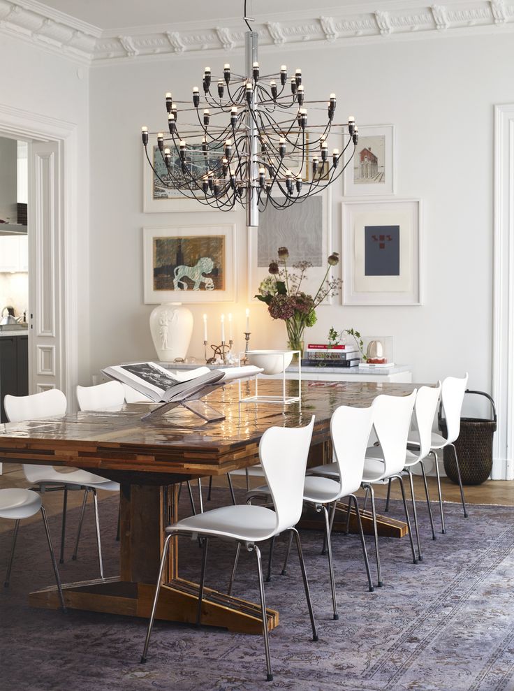 The Chandelier and Dining Chairs are both Mid Century Design Originals in this elegant home in Stockholm.