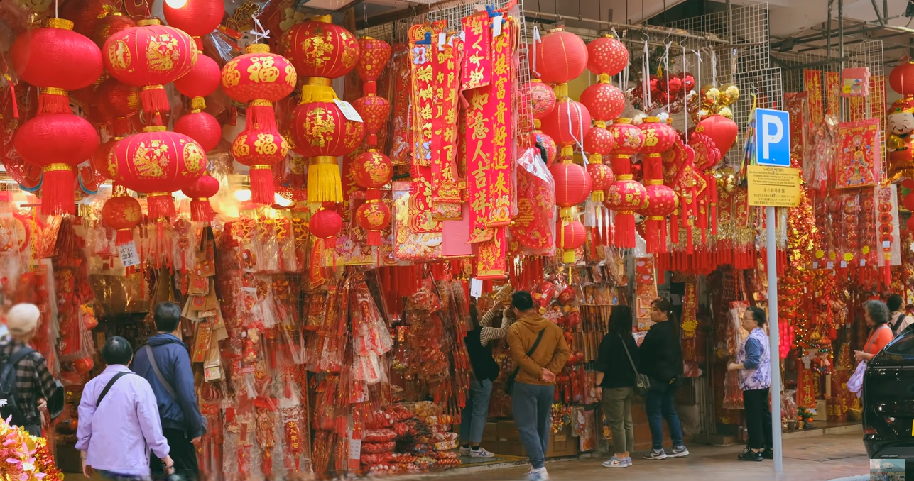 a stall massed with red hanging paper lanterns for chinese new year