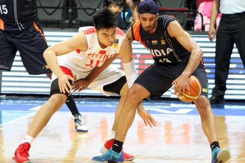 FIBA Asia Cup, India Surprises The World India, ranked 61st in the world, stunned the world when they beat China, ranked 12th, in the third round of the FIBA Asia Cup. India’s coach, the American Scott Flemming, was surprised by the fact that this was India’s first ever win against China. “ In fact, I’m more surprised that this was the first win for India against China. Because we have a lot of potential and this should have happened much earlier,” said Flemming. “I’m so happy for these players. And I’m so happy for the country. I’ve coached for 32 years in the USA, and the only reason I came here, win or lose, was to make a difference in the lives of these players. "There were a few questions asked when we won in January (the Lusofonia Games gold medal beating Angola). I think this win last night adds credibility to that earlier victory. With this win, we are no longer a team with just potential. We can also perform to prove it,” Flemming added. India followed up their win against China with another win against Indonesia in round 4. India’s next match will be against Iran on Tuesday, July 15th. Let’s go India. - The Flame Staff, Sports, Current Events, India