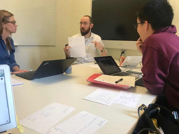 Our team debates ideas to improve BPS customer experience