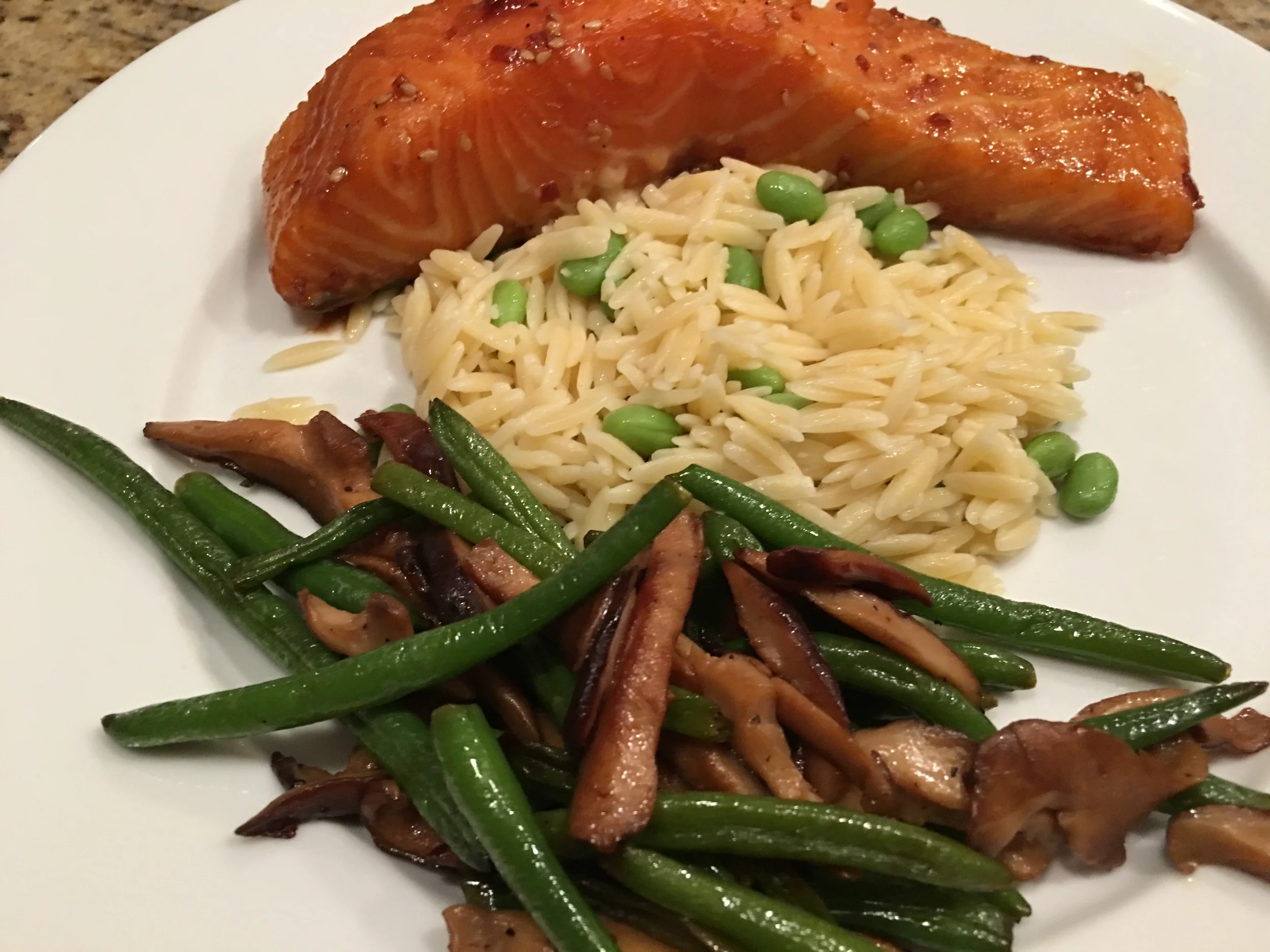 Slow-roasted teriyaki salmon with edamame orzo and shiitake-green bean stirfry
