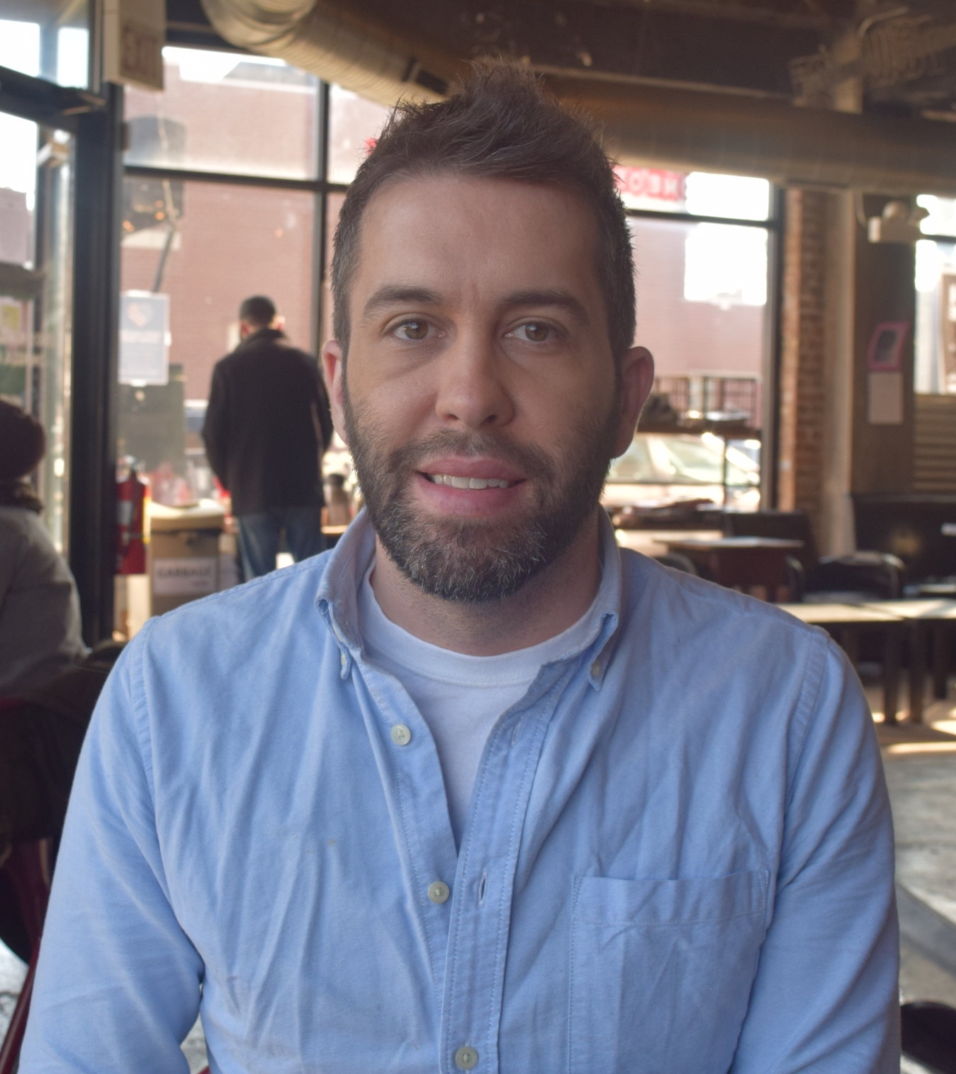 Jake Sapstein Co-owner, Robust Coffee Lounge “Robust Coffee Lounge was started between my husband and I seven years ago. It was at the time the financial markets were crashing, and both of us knew we were going to be out of work. It was an idea that we had that we thought would be something we’d do in our retirement, but it was the only thing we could see to do at that moment, so we decided to go for it. What brought us into the neighborhood was a couple of different factors. One is that the building that we’re in, I was working on with a developer at the time, so I knew the building. As far as considering the neighborhood, my grandparents ran a chain of pharmacies on the South Side for 50 years, so I spent a lot of time in the neighborhood. I used to work at 83rd and Cottage Grove at a pharmacy that was there. That was kind of like my summer job. So, at the time we looked around, and it was pretty obvious that there was a lack of food, lack of drink, so it came down to what would be the best food based business to go into. Coffee is something that everybody can kind of partake in whether they were part of the neighborhood, part of the university - whether they were a young student or a grad student, a kid or retired adult, if they have money or are living on a fixed income. Coffee is $1.50 – you can come, sit, soak up the atmosphere, catch up with friends, get work done, and so that was what we thought would be the best route to take in the neighborhood…There is a great amount of potential in this neighborhood. If you’re in any other neighborhood, you may see dilapidated buildings. You may see open storefronts. You drive even through Lincoln Park, you find on a street like Armitage or Halsted where there used to be thriving businesses, open stores or for rent signs. Here we kind of had that at one point. There were riots and fires in the neighborhood, and it kind of cleared out quite a bit of the infrastructure. So, now people are coming in and actually able to start from the ground up, and I think that’s got a lot of people excited.” 