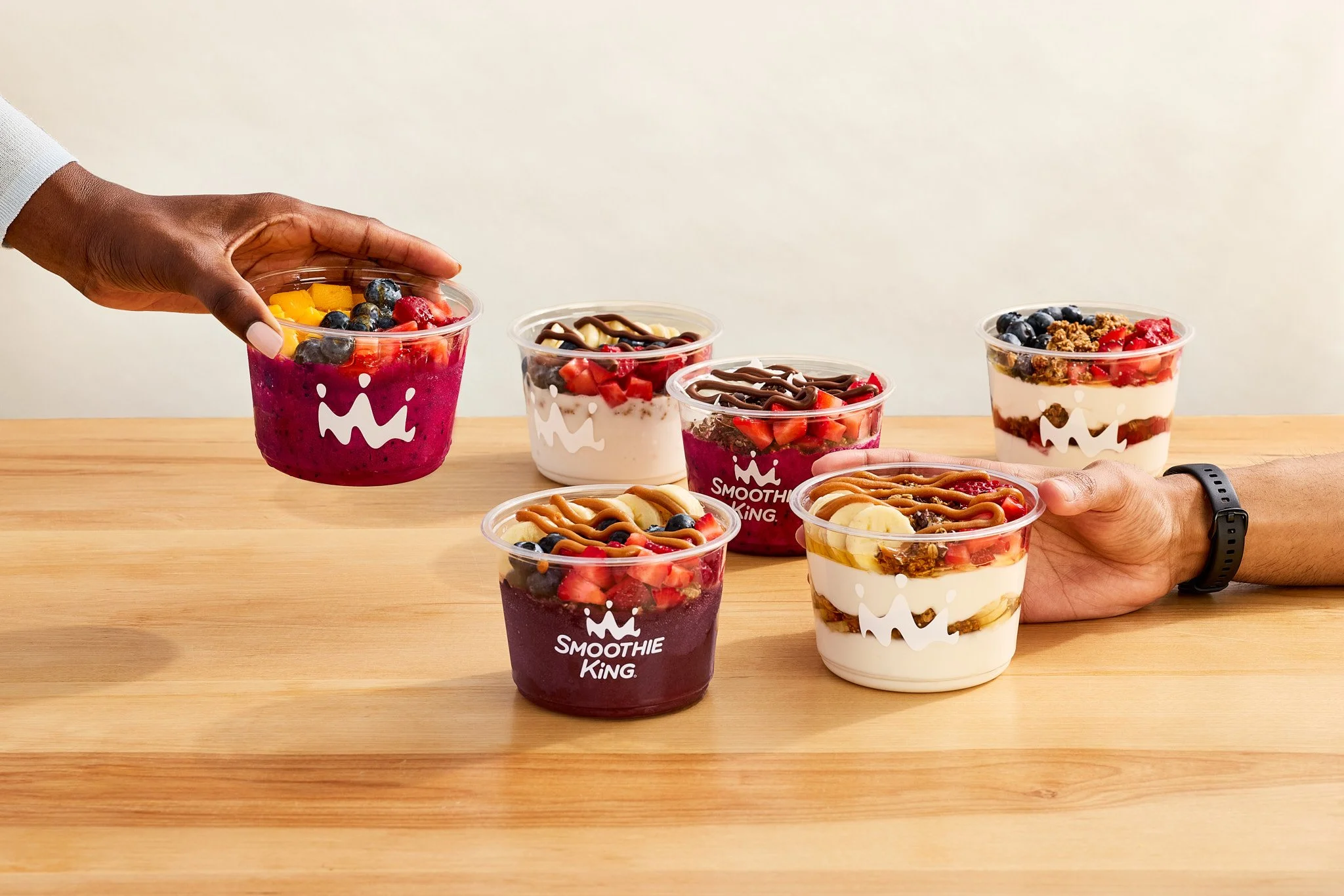 Smoothie Bowls and Yogurt bowls for Smoothie King - 2 hands coming into the frame/ Jennifer Chong  - Food, Beverage and Lifestyle Photographer