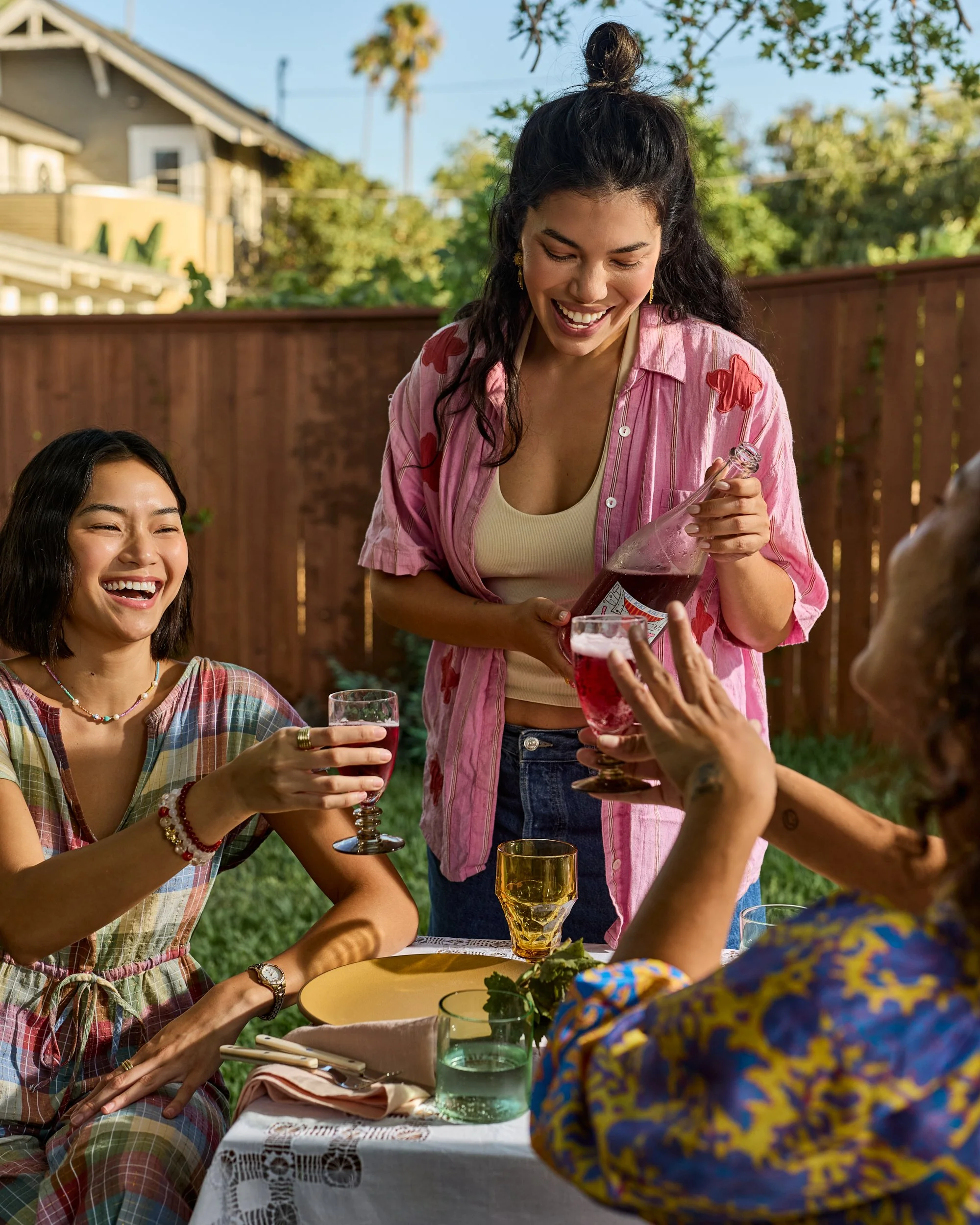 Backyard scene with girl pouring wine / Jennifer Chong Lifestyle Photographer