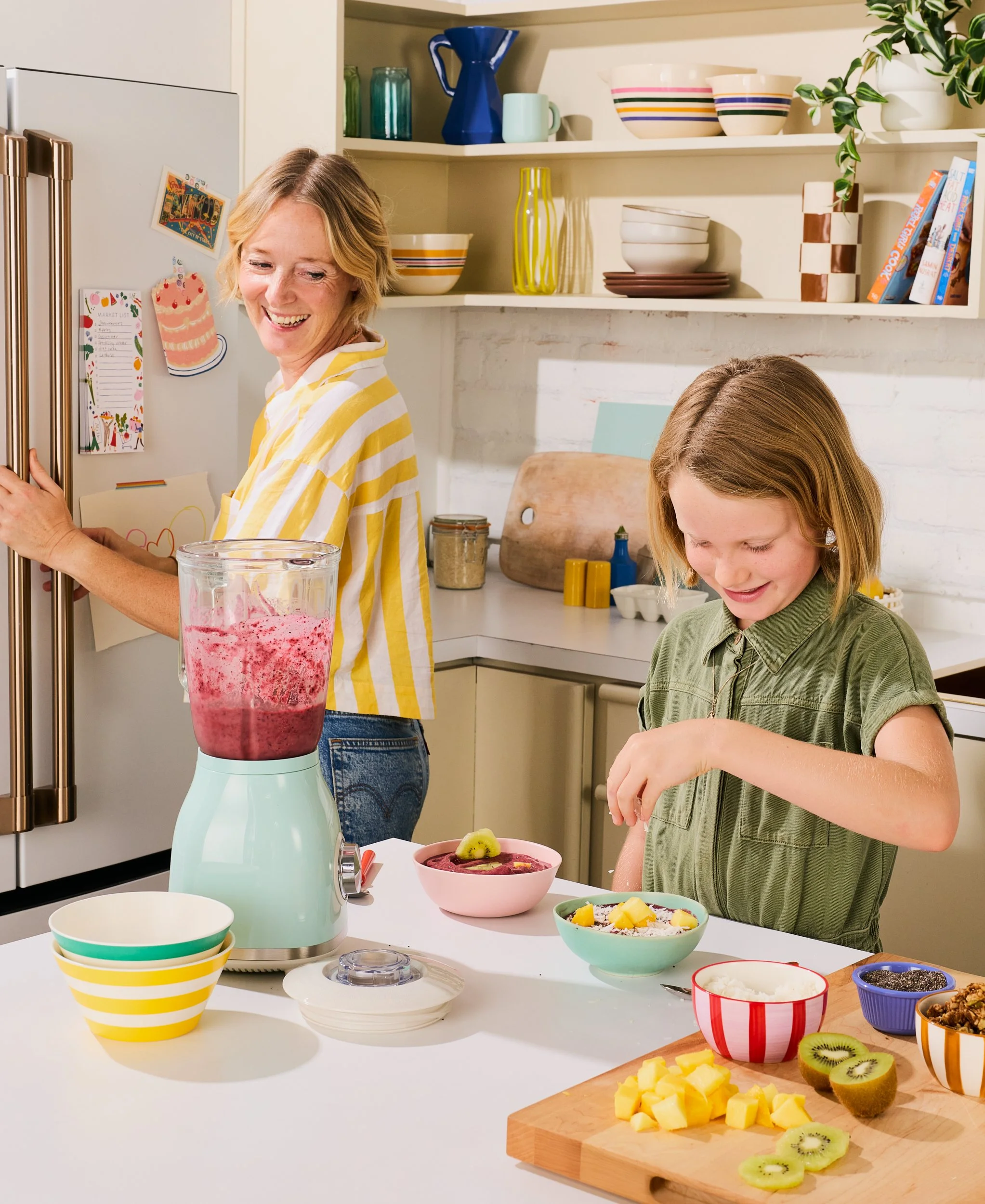 Mom and Daughter in kitchen making Smoothie Bowls  / Jennifer Chong - lifestyle and food photographer 