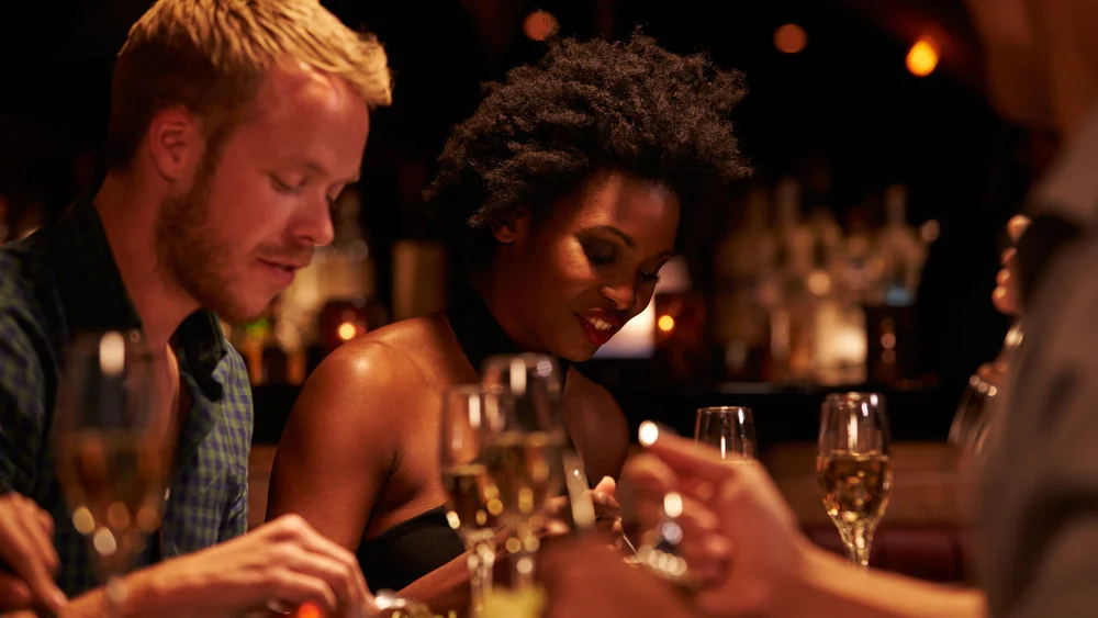 stock-photo-group-of-friends-enjoying-meal-in-restaurant-365582666.jpg