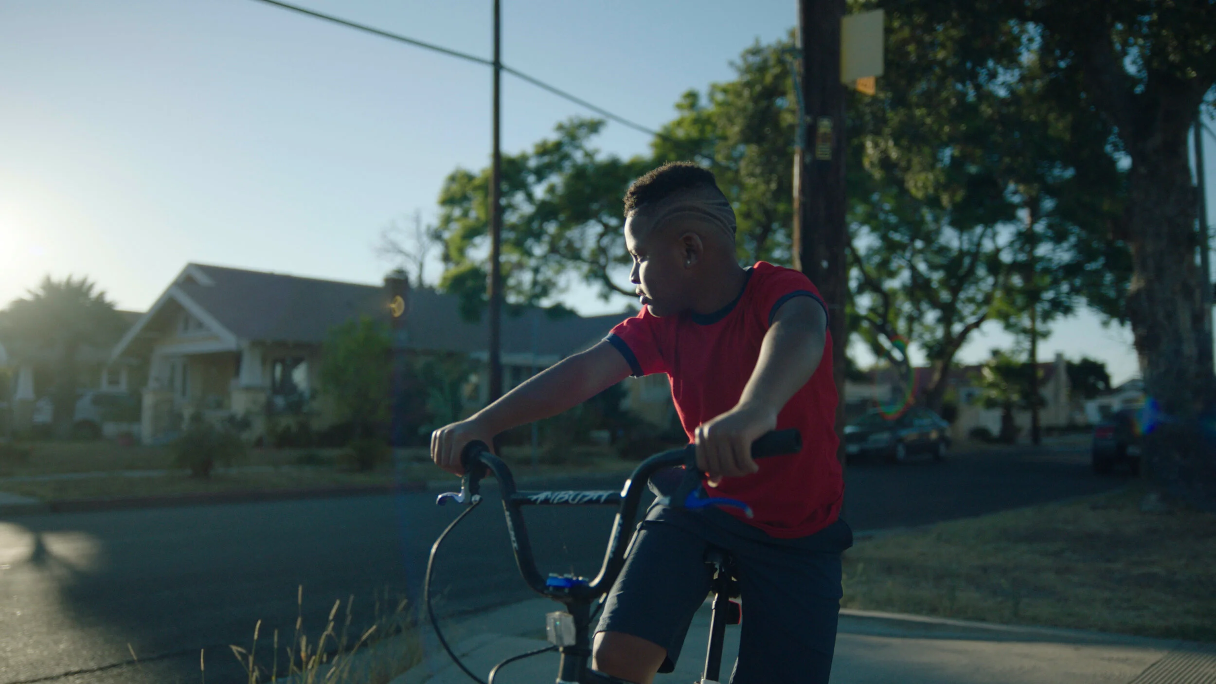 Young Ike on bike looking away.jpg