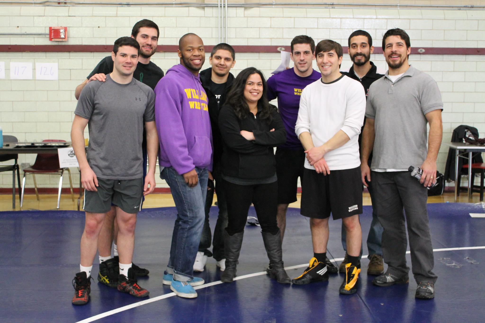 Bior (pictured here in middle) with volunteers, board members, and coaches at the conclusion of the Boston City Championships on January 20, 2013 at TechBoston Academy (Dorchester).