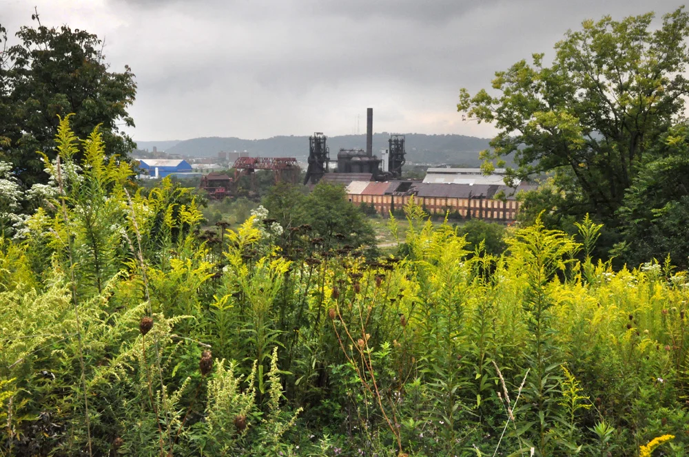 Carrie Furnace is the last remaining unused blast furnace in the Pittsburgh area. It was built in 1881; furnaces 6 and 7, all that remain, functioned from 1908 to 1978, when the plant was shut down. Carrie made iron for the Homestead Works, at its peak employing approximately 2,400 people and producing over 1,000 tons of iron a day.
©
Normal
0
false
false
false
EN-US
X-NONE
X-NONE
/* Style Definitions */
table.MsoNormalTable
{mso-style-name:"Table Normal";
mso-tstyle-rowband-size:0;
mso-tstyle-colband-size:0;
mso-style-noshow:yes;
mso-style-priority:99;
mso-style-parent:"";
mso-padding-alt:0in 5.4pt 0in 5.4pt;
mso-para-margin-top:0in;
mso-para-margin-right:0in;
mso-para-margin-bottom:10.0pt;
mso-para-margin-left:0in;
line-height:115%;
mso-pagination:widow-orphan;
font-size:11.0pt;
font-family:"Calibri","sans-serif";
mso-ascii-font-family:Calibri;
mso-ascii-theme-font:minor-latin;
mso-hansi-font-family:Calibri;
mso-hansi-theme-font:minor-latin;}
Brian Cohen, 2011.