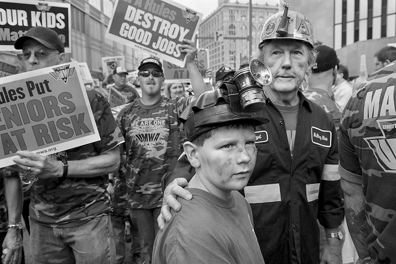  United Mine Worker Floyd Macheska from West Newton, PA, and his grandson Stephen Macheska, nine, from Belle Vernon, PA, watch as fourteen members of the United Mine Workers of America are arrested after refusing to move from the steps of the Federal