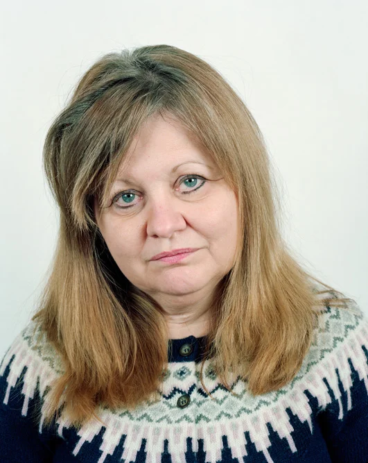 Mollie Caryll poses for a portrait at her home in Valley Grove, WV on 02/11/2016. Caryll, who lives near several well pads and a large compressor station, says her health has been affected by energy industry activities. Caryll said she was forced to leave her job as a bank manager due to extreme fatigue, headaches, skin rashes and endocrine disorders, all of which began suddenly after the start of drilling activity in the area. She and her husband Dan moved to the house six years ago, hoping for a quiet place to retire. "We did everything right ", she said, "then it all changed overnight." © Noah Addis/MSDP 2015