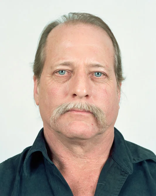 Jeff T. Bond poses for a portrait in Senecaville, Ohio on 02/19/2016. Bond, who has lived in Seneca Township for 35 years with his wife Kerri, claims that energy companies and state officials are harassing them and covering up the theft of gas and mineral leases on their property. The dispute, which began in 2011, is still not resolved. He also claims that air and water pollution are affecting his health. Bond says he has experienced respiratory and other problems. "Our land is not safe anymore." Bond said, "Things aren't the same and we can't get anyone to acknowledge the problems." © Noah Addis/MSDP 2015
