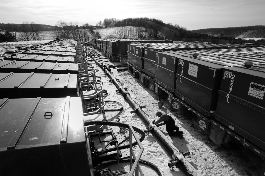  Near Dimock Pa. Cabot drilling operations dot the once rural landscape. These trucks contain fracking fluid, a blend of water and chemicals that will be used to frack a nearby well.©&nbsp;Lynn Johnson/MSDP 2012 