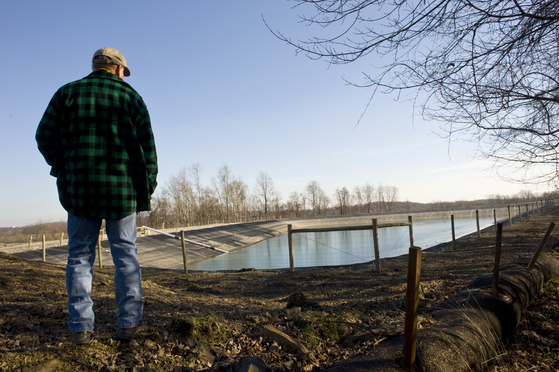  A landowner observes a freshwater impoundment built by EQT near the edge of his farm in Greene County.&nbsp; ©  &nbsp;Martha Rial/MSDP 2012  