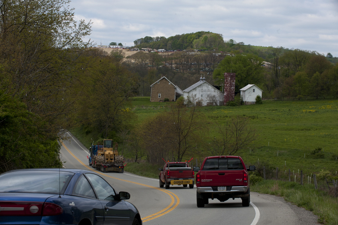  A truck hauling heavy equipment for the natural gas industry slows traffic along Route 188 in Jefferson Township, Greene County.&nbsp; ©&nbsp;Martha Rial/MSDP 2012 