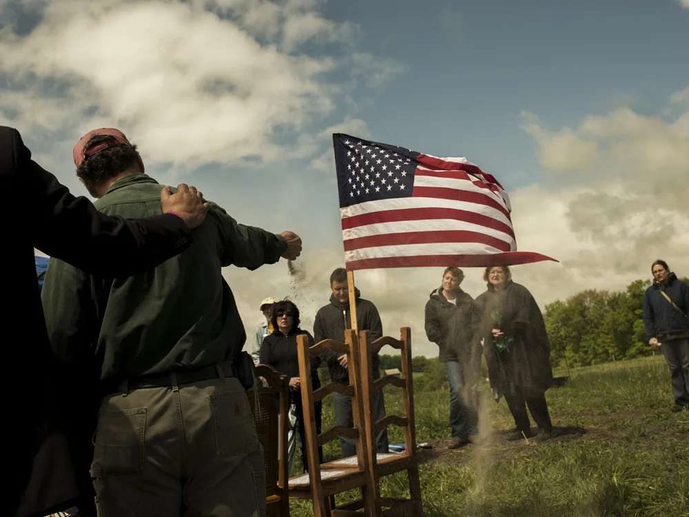 Dr. Stephen Cleghorn declares his farm forever frack free in a memorial tribute to his wife Lucinda Hart Gonzalez who died of breast cancer. Environmental activists from across the region attended to honor Lucinda and participate in the release of her ashes. Reynoldsville, Jefferson County, 2012. © Nina Berman/MSDP 2012