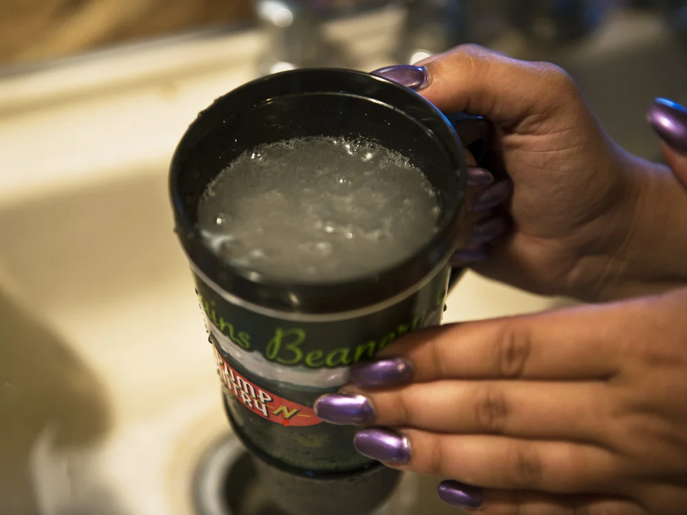 Water from the kitchen faucet of Jodie Simons and Jason Lamphere home. They say their water was contaminated by gas drilling operations. © Nina Berman/MSDP 2012