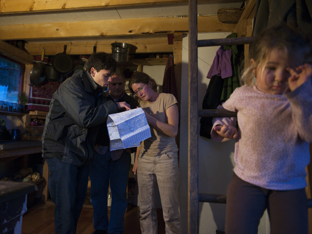  Matt Walker with the Clean Air Council, and Ralph Kisburg of the Responsible Drilling Alliance visit the one-room home of organic farmers Adron and Mary Delarosa to alert them to a meeting about a compressor station planned near their home. The stat