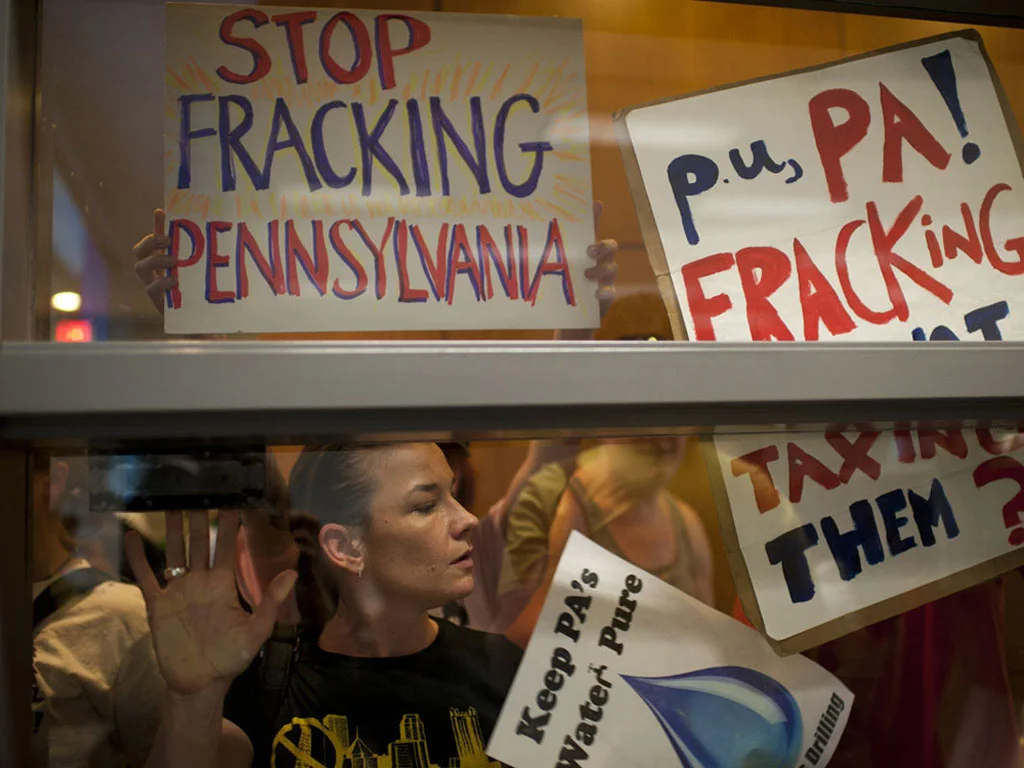 Dana Dolney and other anti-shale gas-drilling protestors are locked out of a public meeting of the Governor's Marcellus Shale Advisory Commission. Protestors were eventually allowed to enter and give brief testimonies. Harrisburg, 2011. © Nina Berman/MSDP 2011