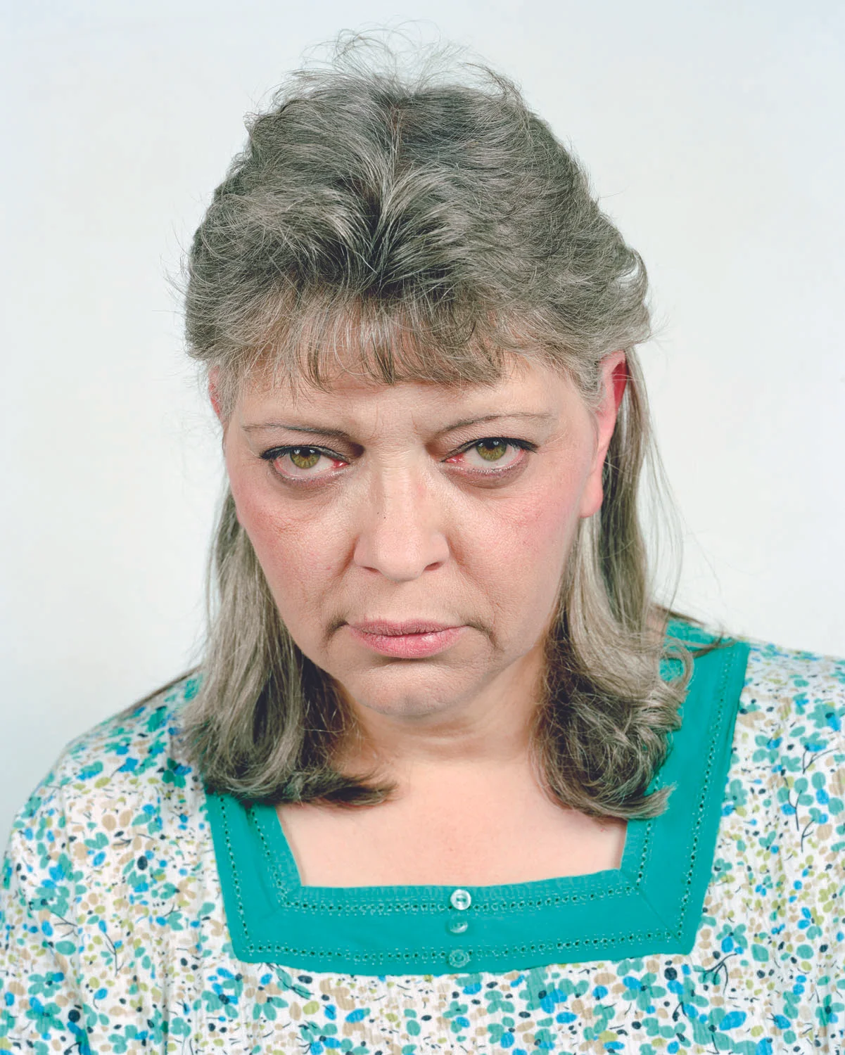 Janet McIntyre poses for a portrait at her home in Connoquenessing Township, PA on 04/30/2012. McIntyre, who has lived in her home for 20 years, claims that her water turned purple and foamy after several Marcellus Shale gas wells were drilled in the area in January of 2011. She and her family now drink only bottled water. © Noah Addis/MSDP 2011