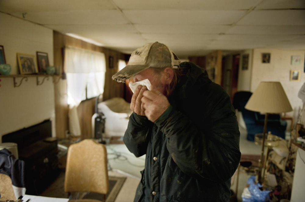  After workers hauled away two water tanks that supplied three homes from his backyard, John "Denny" Fair went inside his small home and became teary-eyed. When Fair reconnected his water well, it pumped out orange-brown water that he and the neighbo