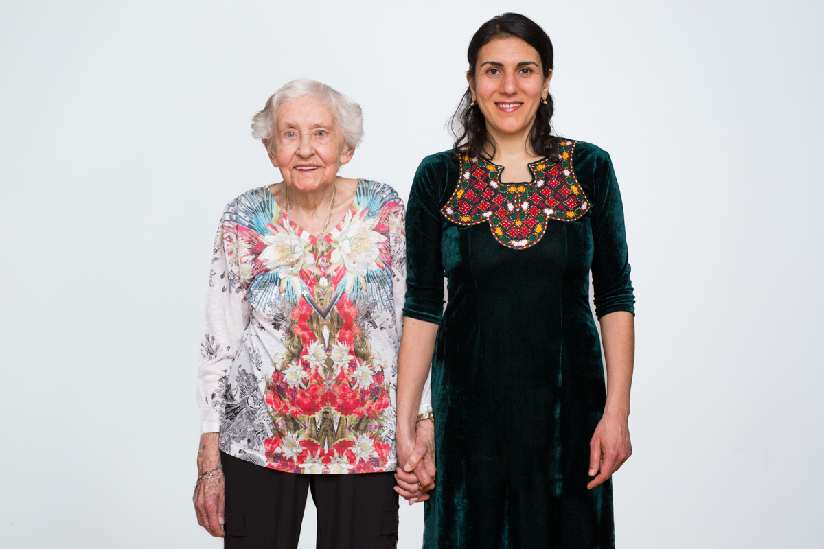 Gertrud Wunder was born in East Prussia, Germany. She arrived in the U.S. in 1952. Meryembibi Mammedova was born in Turkmenistan. She arrived in the U.S. in 2005. Both come from countries that are part of the former U.S.S.R. Gertrud moved to the U.S. with her husband and five-year-old daughter for more opportunities. There was not a lot of work in war-torn Germany where they were living. They were sponsored by relatives living in New York City. Meryembibi met her husband while he was serving in the Peace Corps in Turkmenistan. Soon after they were married, they moved to the U.S. Gertrud: “My aunt and uncle picked us up from the boat. The next morning, we went out for a walk around the neighborhood and I have to mention this. I saw in the garbage cans these big loaves of bread, not even used, not open, nothing. And we had hunger big you know, we were starving over there at times. When we came home, I said to my aunt, ‘What is this, all those loaves of bread in the garbage can?’ ‘Yes, they only eat very fresh bread. This is too old. That’s why they put it in a garbage can.’ I never could get over that.” Meryembibi: “The first year was rough because I came here from a country where it’s all about family and we gather a lot. I didn’t spend a day without the family. And when I came here I only had my husband and then my parents-in-law. But they live in a different neighborhood and we would see them but it wasn’t something I was used to. So, for me it was a shock.” Annie O'Neill/TDW 2017