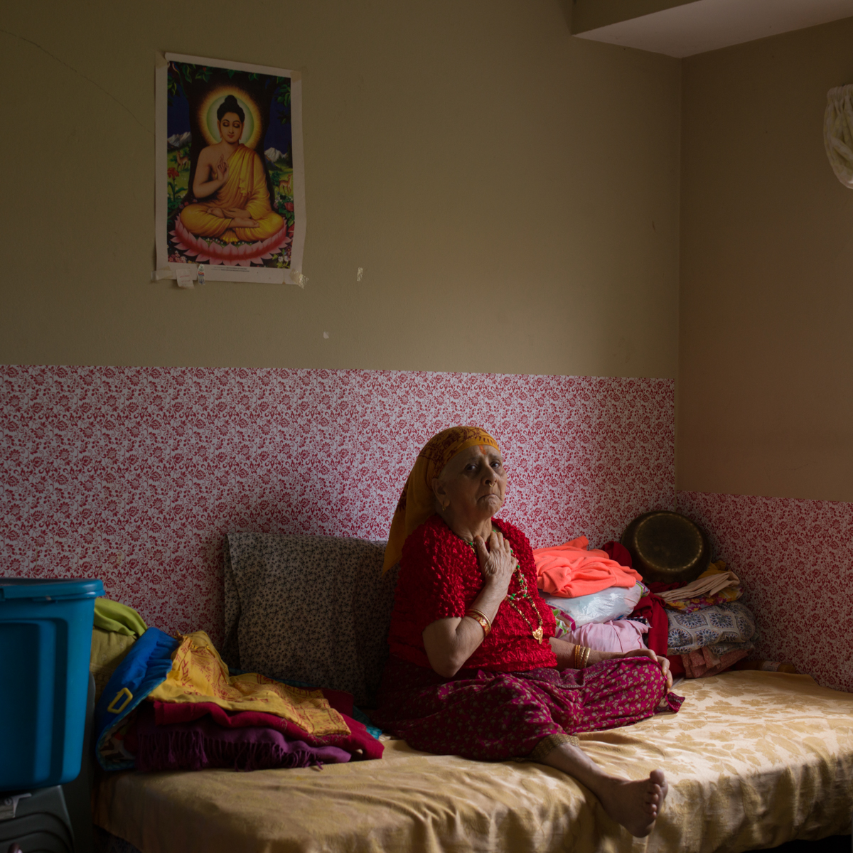  Sabitra Subedi is Bhutanese from Nepal. Her room in this modest apartment in Pittsburgh, home for the past six years, is part shrine and part storage for the multiple generations that live here.  © Lynn Johnson/TDW 2017 