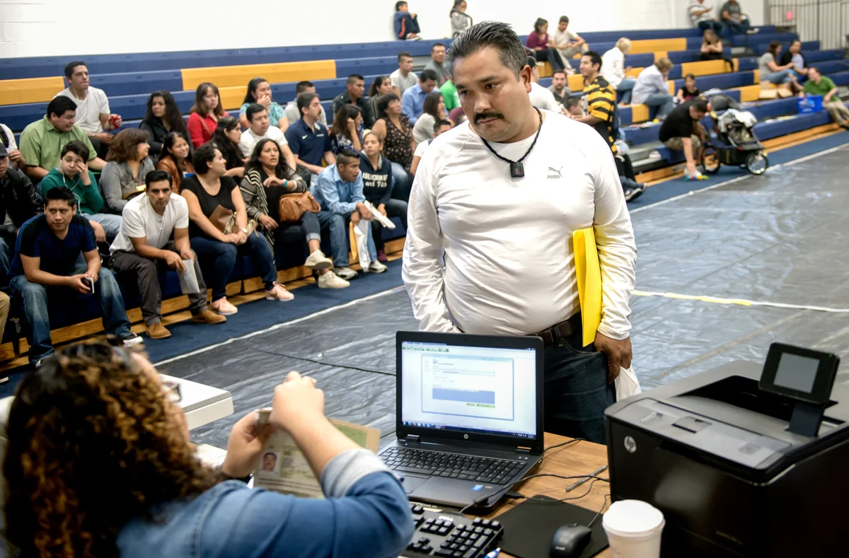 Jose gets his Mexican passport renewed during the one-day service offered by the Mexican Consulate at Central Catholic High School in the Oakland neighborhood of Pittsburgh. The “mobile consulate” as it is called, provide consular ID, passport renewals and other services. © Nate Guidry/TDW 2017